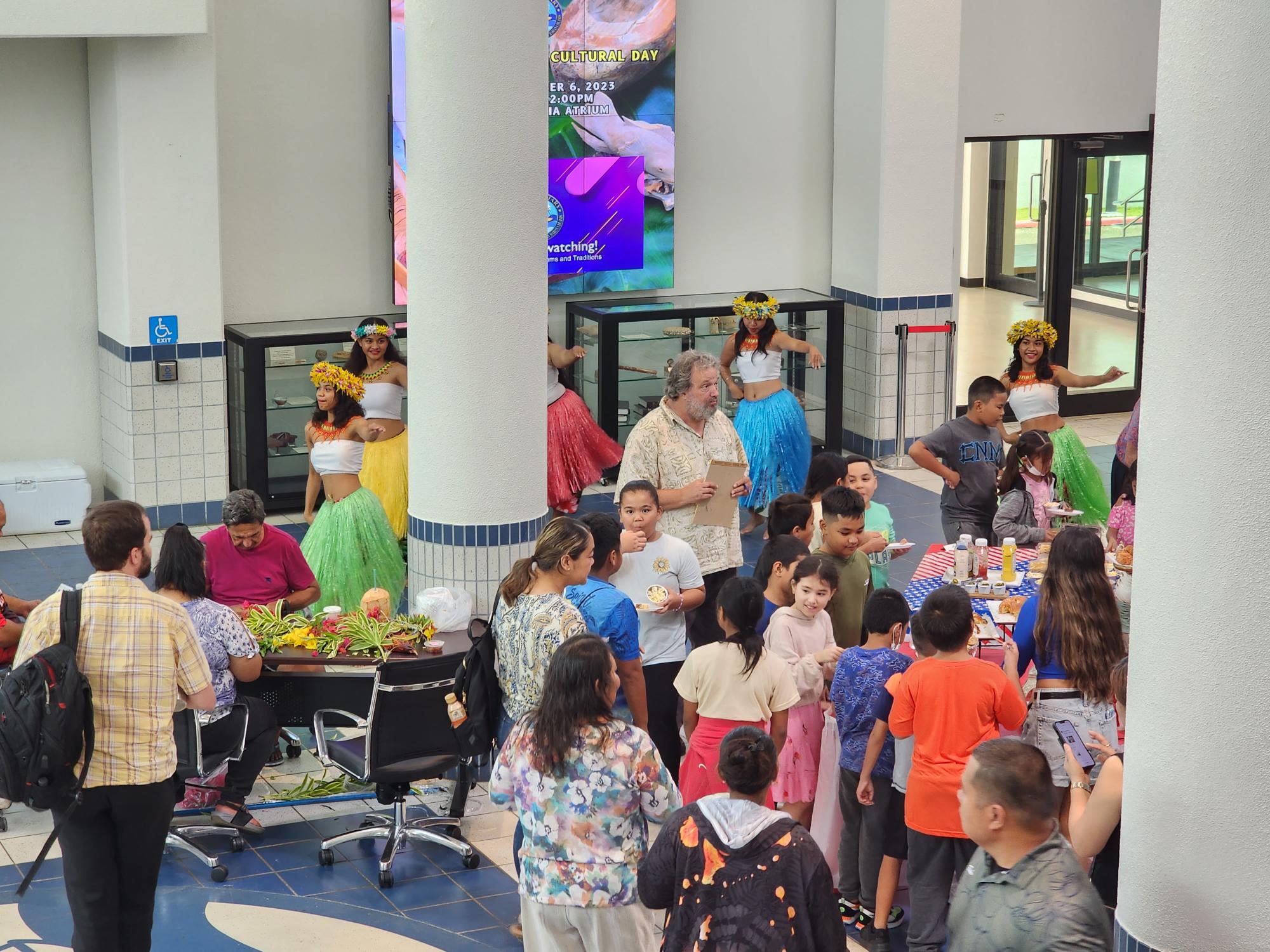 Students and community members enjoy the cultural performances, exhibits and culinary presentations during the Commonwealth Cultural Day celebration at the Guma Hustisia on Friday.