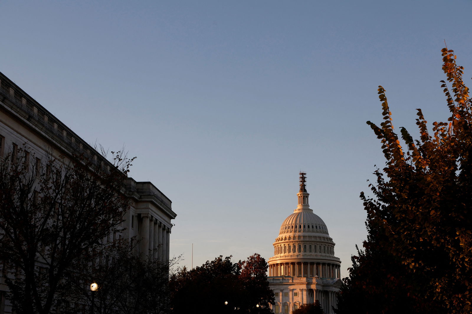 The sun sets at the U.S. Capitol as House Republican candidates hold a forum before they select the next GOP House Speaker nominee on Capitol Hill in Washington, U.S. October 23, 2023. 