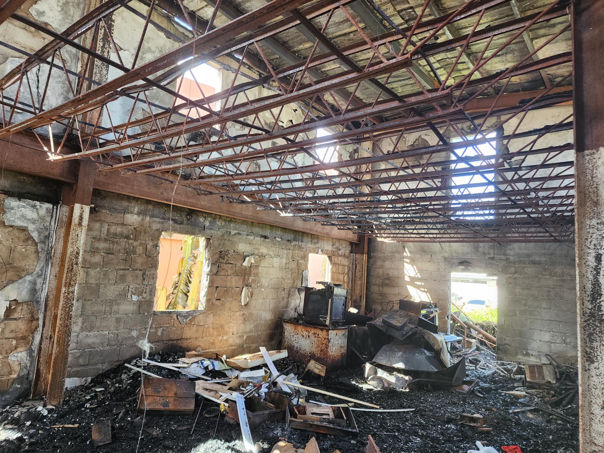 What remained of the former Joeten apartment building in Chalan Kanoa after a fire gutted the abandoned structure on Saturday.
