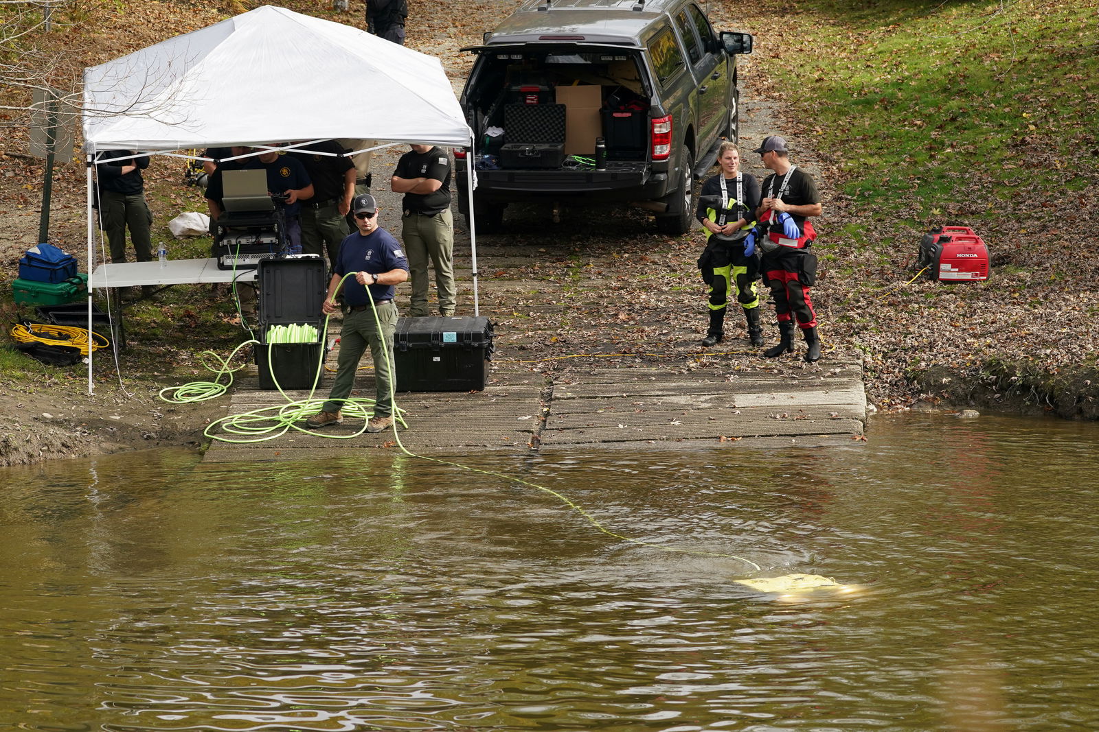 Members of law enforcement search a river in Lisbon Falls, Maine, U.S., October 27, 2023. 