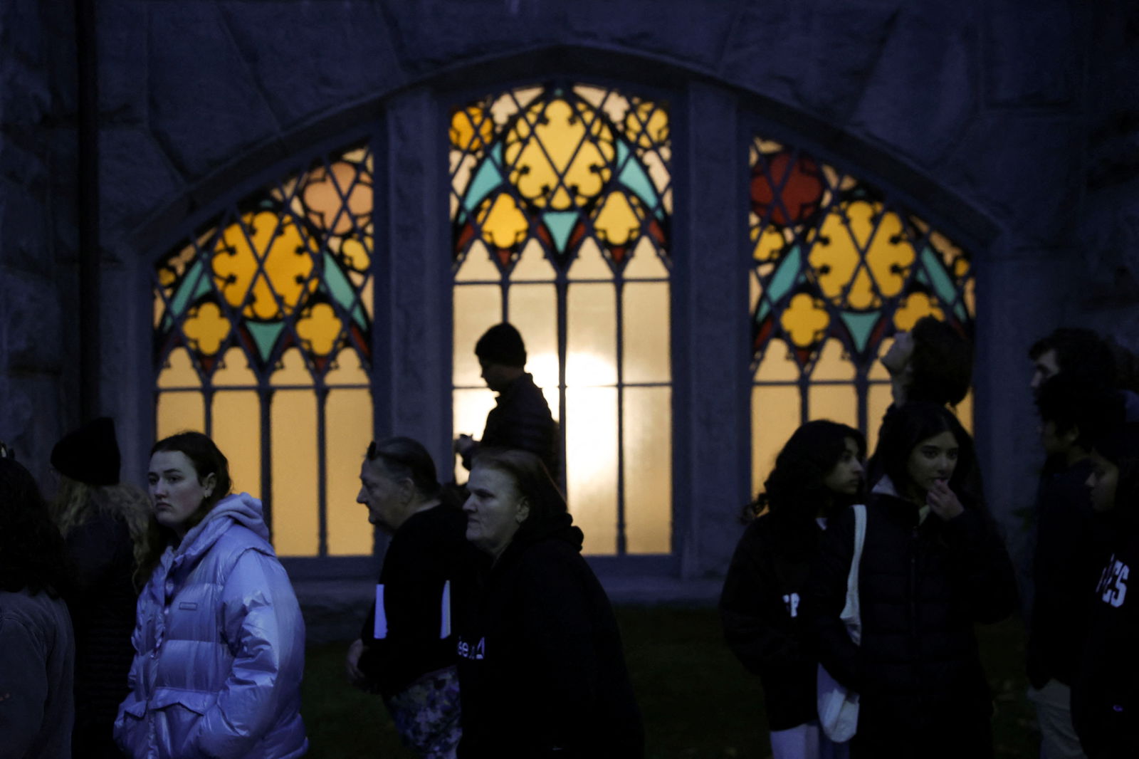 Mourners take part in a vigil for the victims of the deadly mass shooting outside the Basilica of Saints Peter and Paul, in Lewiston, Maine, U.S., October 29, 2023. 