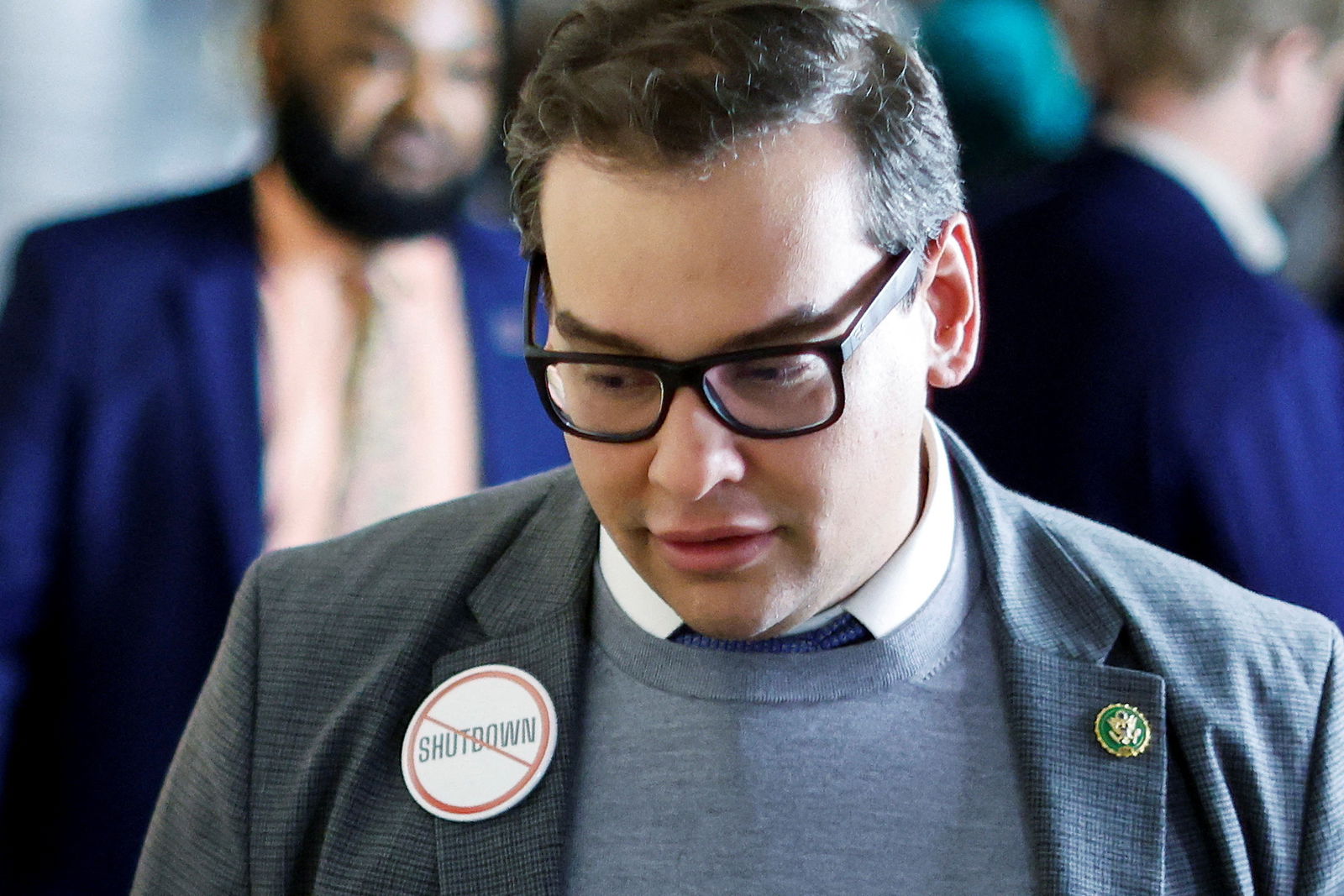 FILE PHOTO: U.S. Representative George Santos (R-NY) wears a "no shutdown" button as he arrives for a House Republican conference meeting following a series of failed votes on spending packages at the U.S. Capitol ahead of a looming government shutdown in Washington, U.S. September 29, 2023. REUTERS/Jonathan Ernst/File Photo
