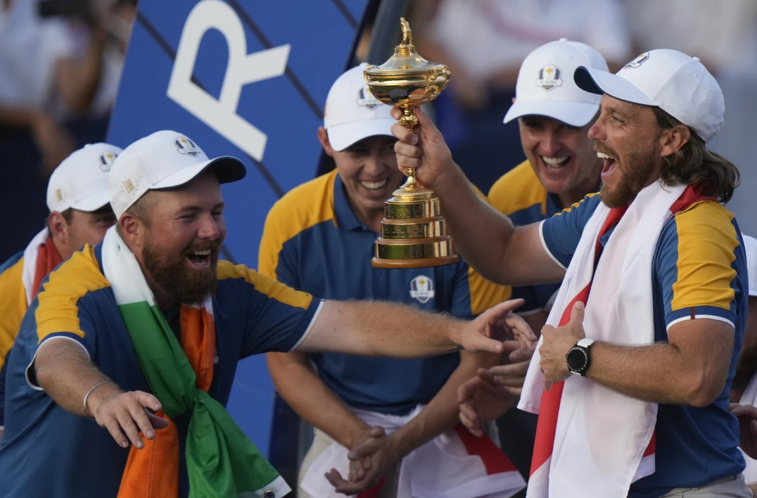 Europe’s Tommy Fleetwood lifts the Ryder Cup at the Marco Simone Golf Club in Guidonia Montecelio, Italy, Sunday, Oct. 1, 2023.