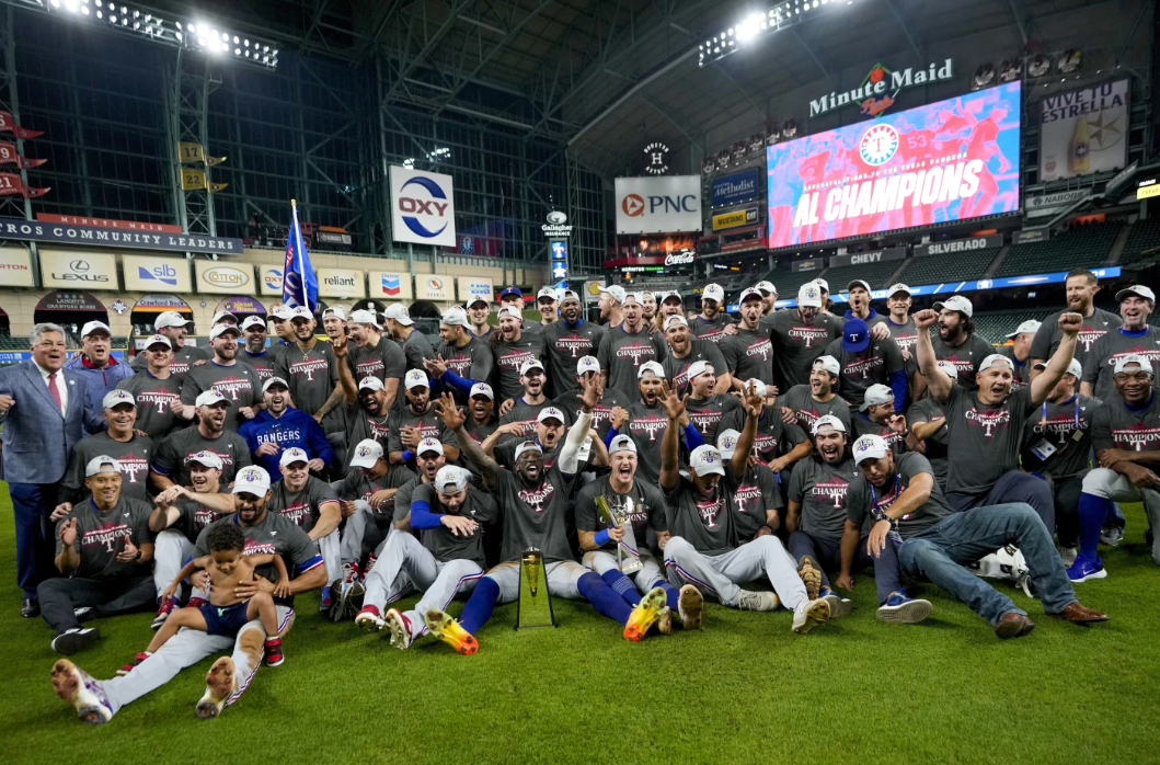 The Texas Rangers pose for a picture after Game 7 of the AL Championship Series against the Houston Astros Monday, Oct. 23, 2023 in Houston. The Rangers won 11-4 to bag the series 4-3.