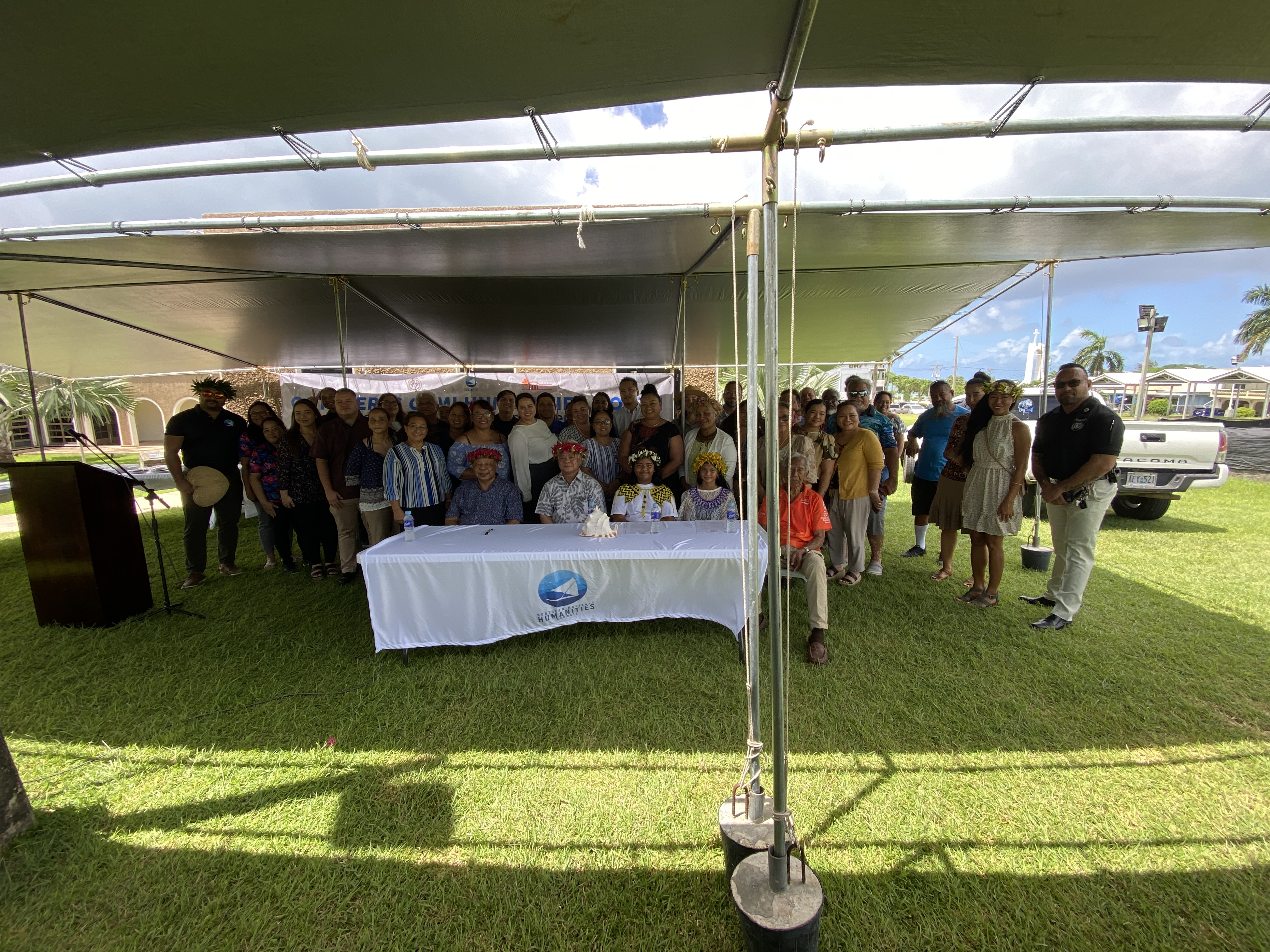 CNMI officials led by Gov. Arnold I. Palacios and Lt. Gov. David M. Apatang pose for a photo with local culture advocates and staff of the Northern Marianas Humanities Council.