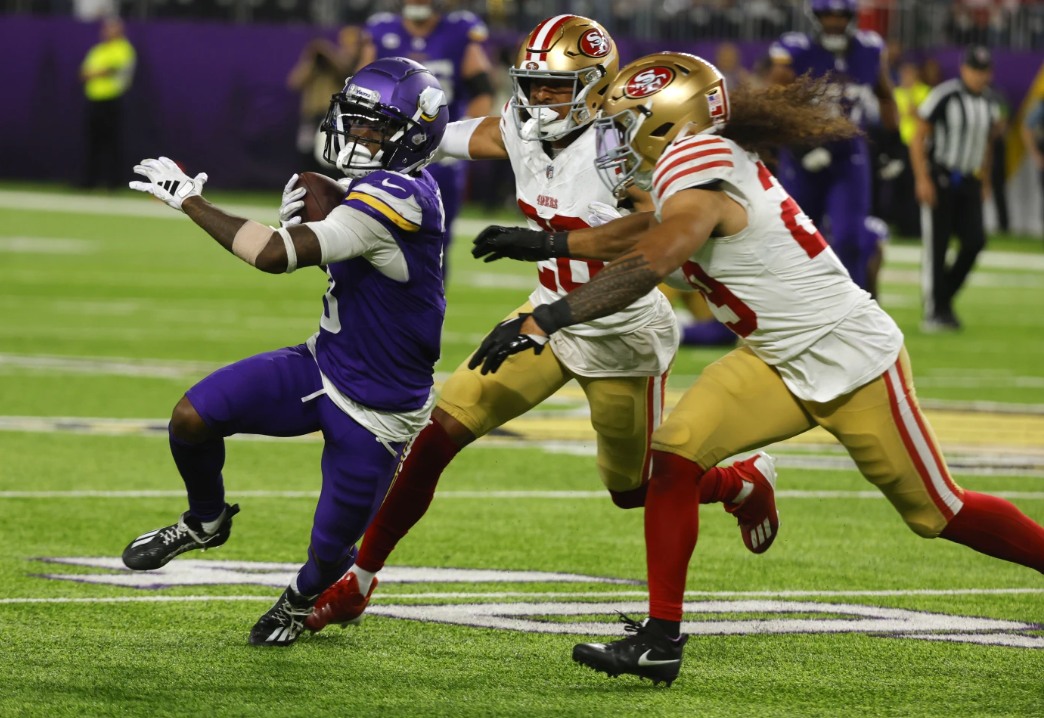 Minnesota Vikings wide receiver Jordan Addison (3) runs from San Francisco 49ers safety Talanoa Hufanga (29) during the second half of an NFL game, Monday, Oct. 23, 2023 in Minneapolis.