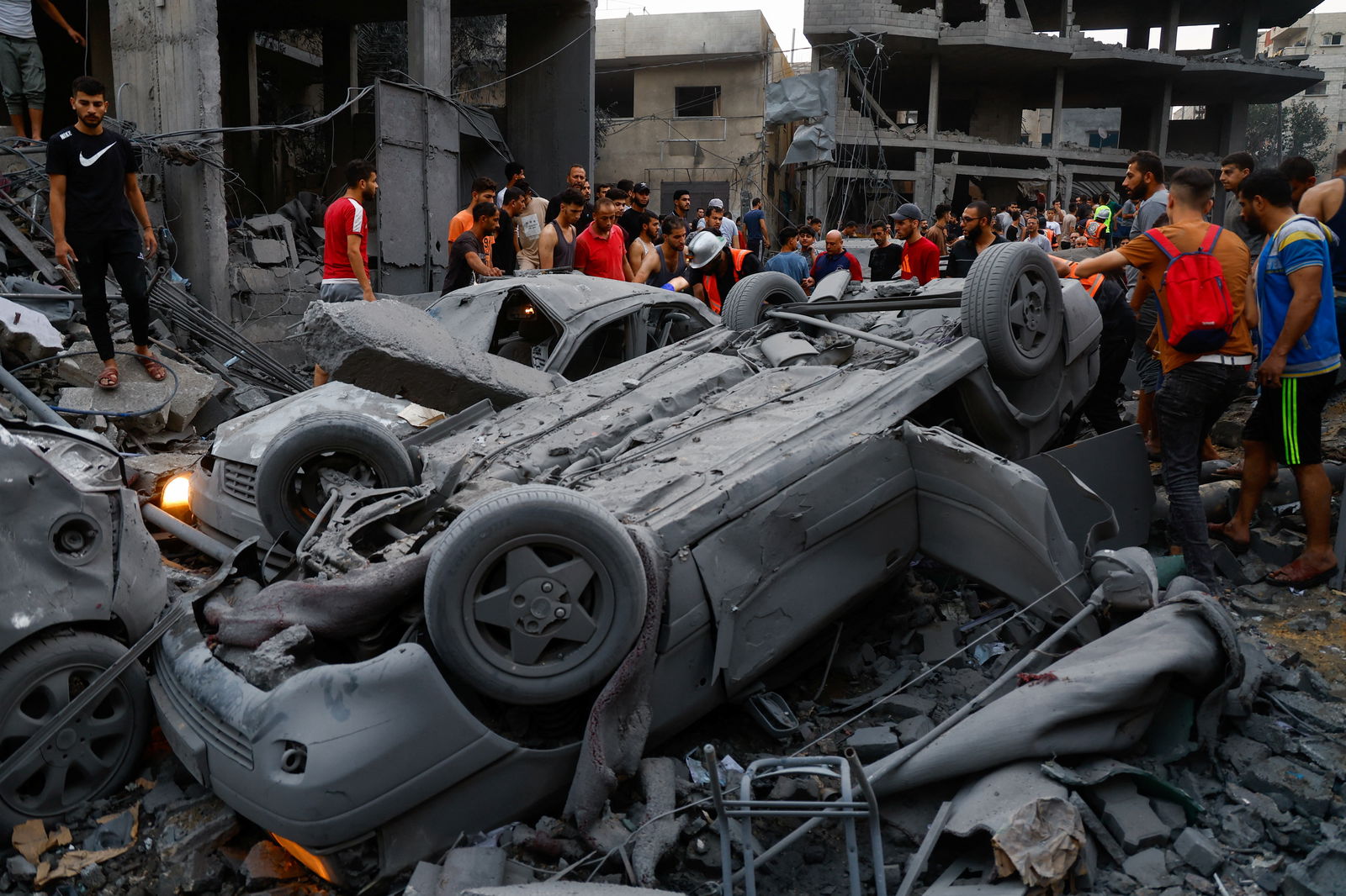 Palestinians inspect damages in the aftermath of Israeli strikes, following a Hamas surprise attack, at Beach refugee camp, in Gaza City, October 9, 2023. 