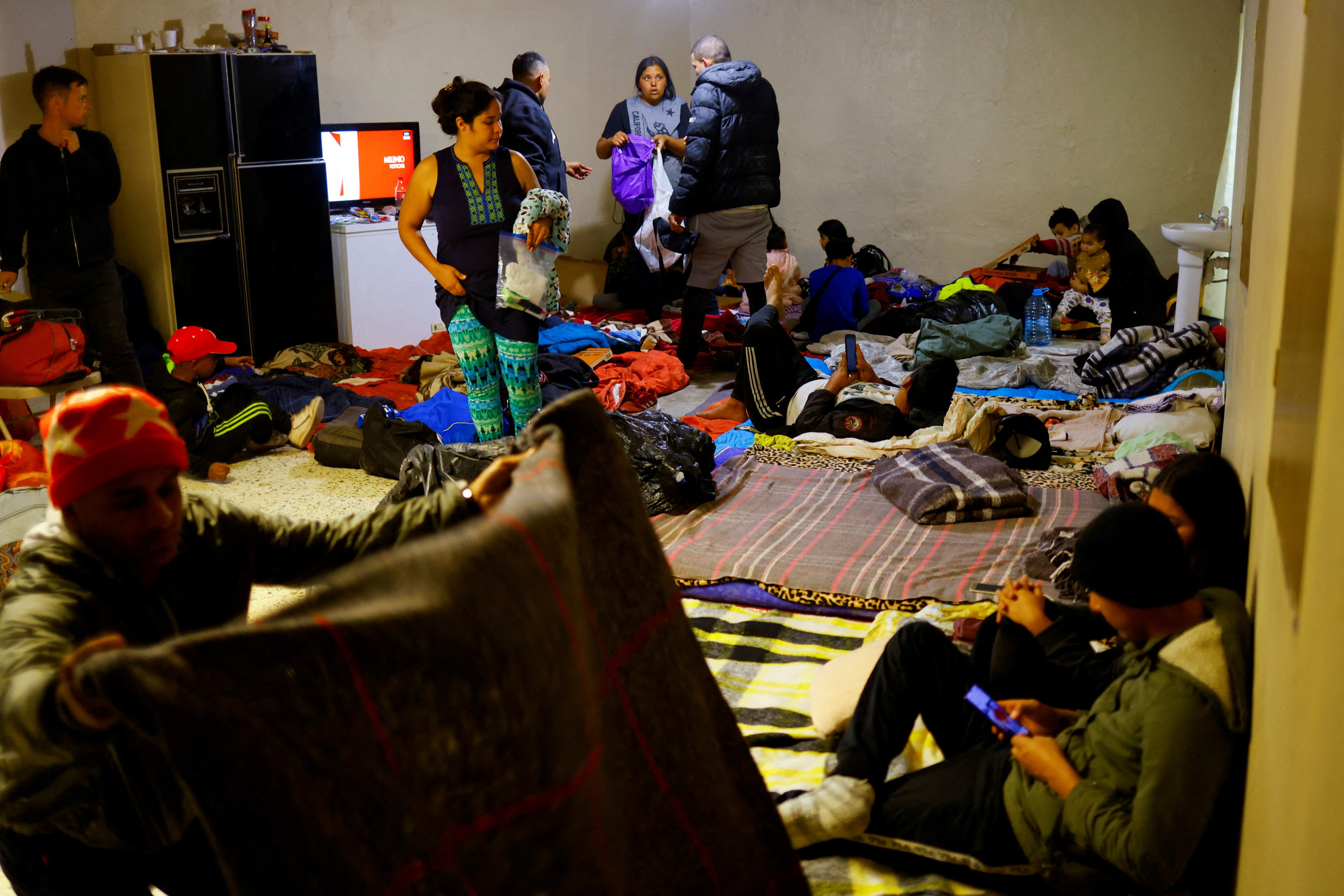 Venezuelan migrants, some expelled from the U.S. to Mexico under Title 42 and others who have not yet crossed after the new immigration policies, rest in an old warehouse that was improvised as a shelter in Ciudad Juarez, Mexico December 1, 2022. 