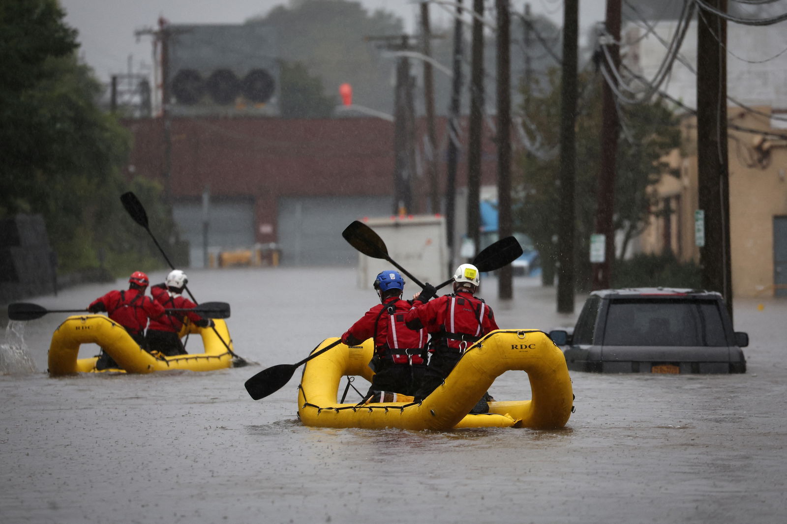 Special Operations Unit rescue personnel with the Westchester County Emergency Services paddle in rafts as they check buildings for victims trapped in heavy flooding in the New York City suburb of Mamaroneck, New York, U.S., September 29, 2023. 