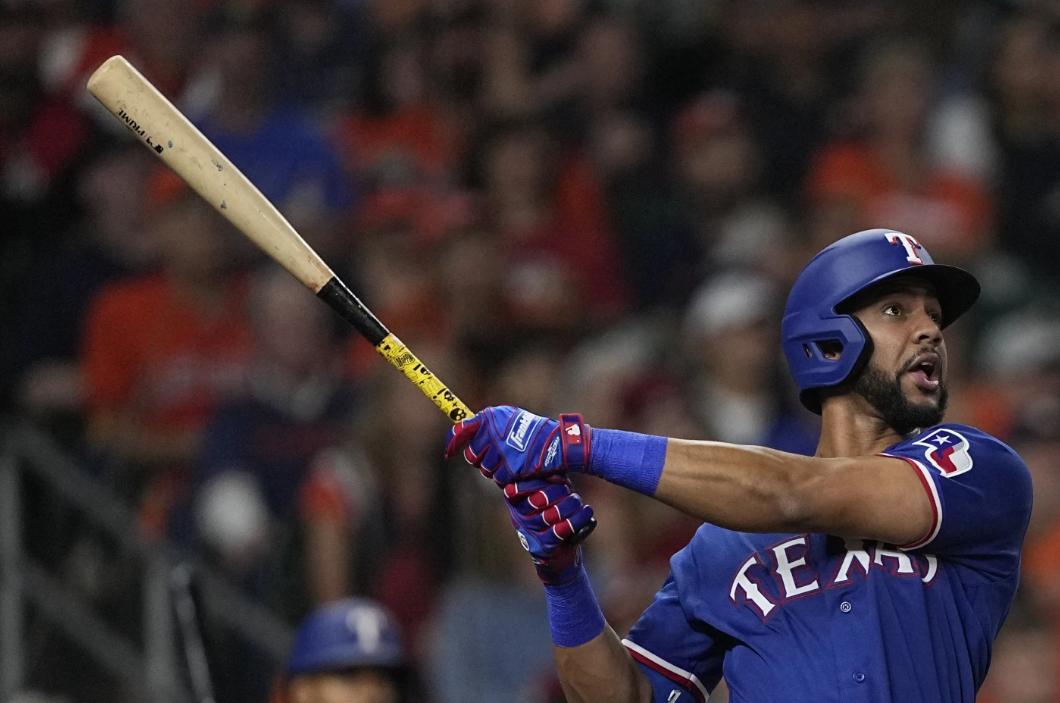 Texas Rangers’ Leody Taveras hits a home run during the fifth inning of  Game 1 of the AL Championship Series against the Houston Astros Sunday, Oct. 15, 2023, in Houston.