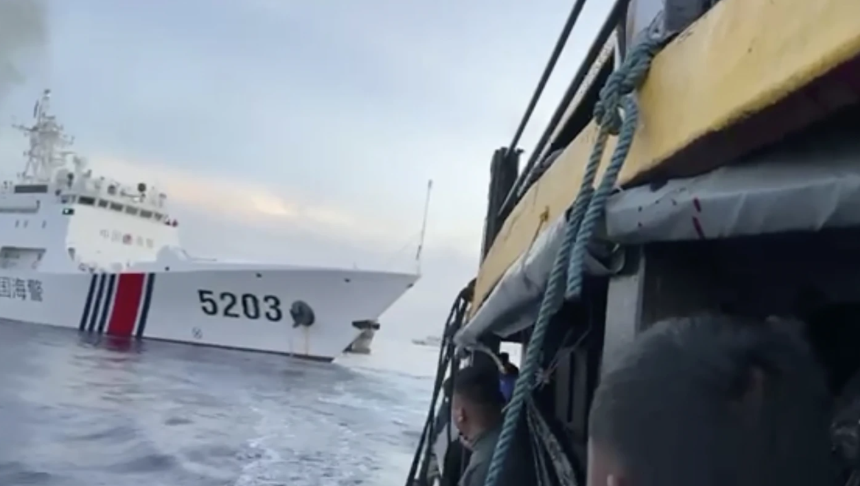 In this image from a video released by the Armed Forces of the Philippines, Filipino sailors look after a Chinese coast guard ship with bow number 5203 as it is about to bump the Filipinos’ supply boat approaching Second Thomas Shoal, locally called Ayungin Shoal, at the disputed South China Sea (West Philippine Sea) on Sunday, Oct. 22, 2023.