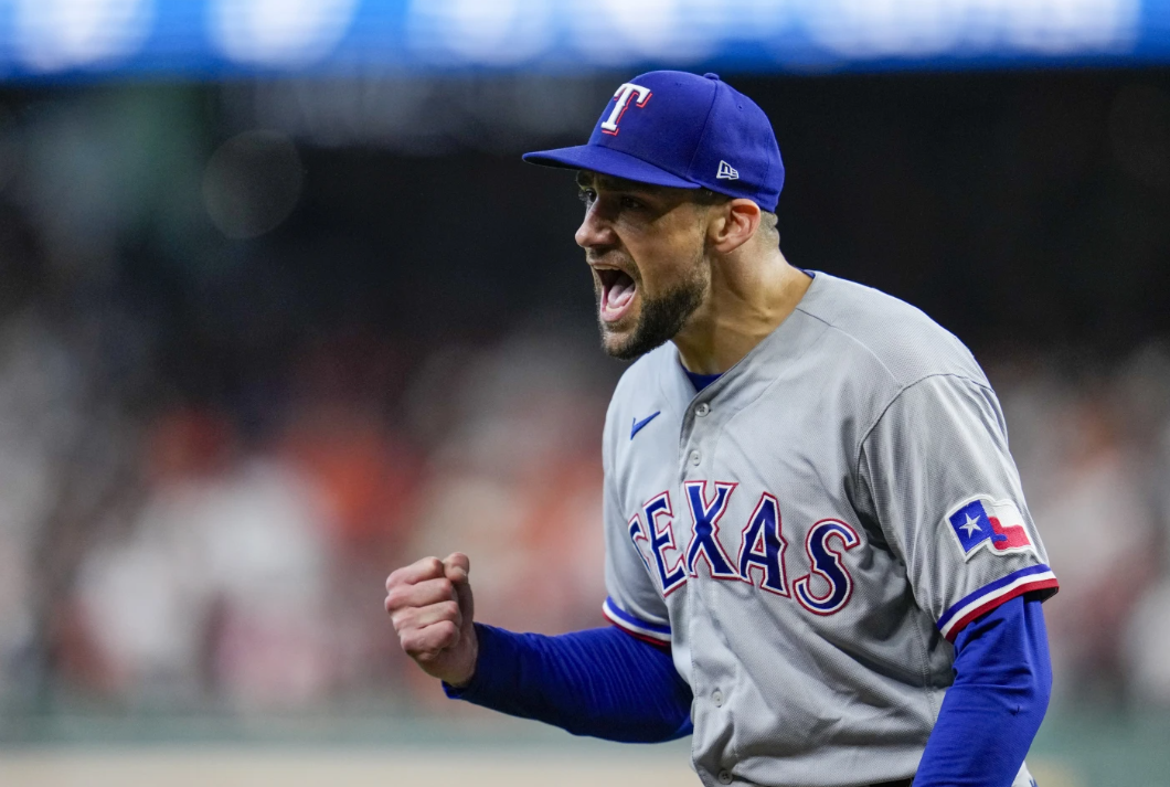 Texas Rangers relief pitcher Nathan Eovaldi reacts after getting out of a bases-loaded jam in the fifth inning of Game 2 of the AL Championship Series against the Houston Astros Monday, Oct. 16, 2023, in Houston.