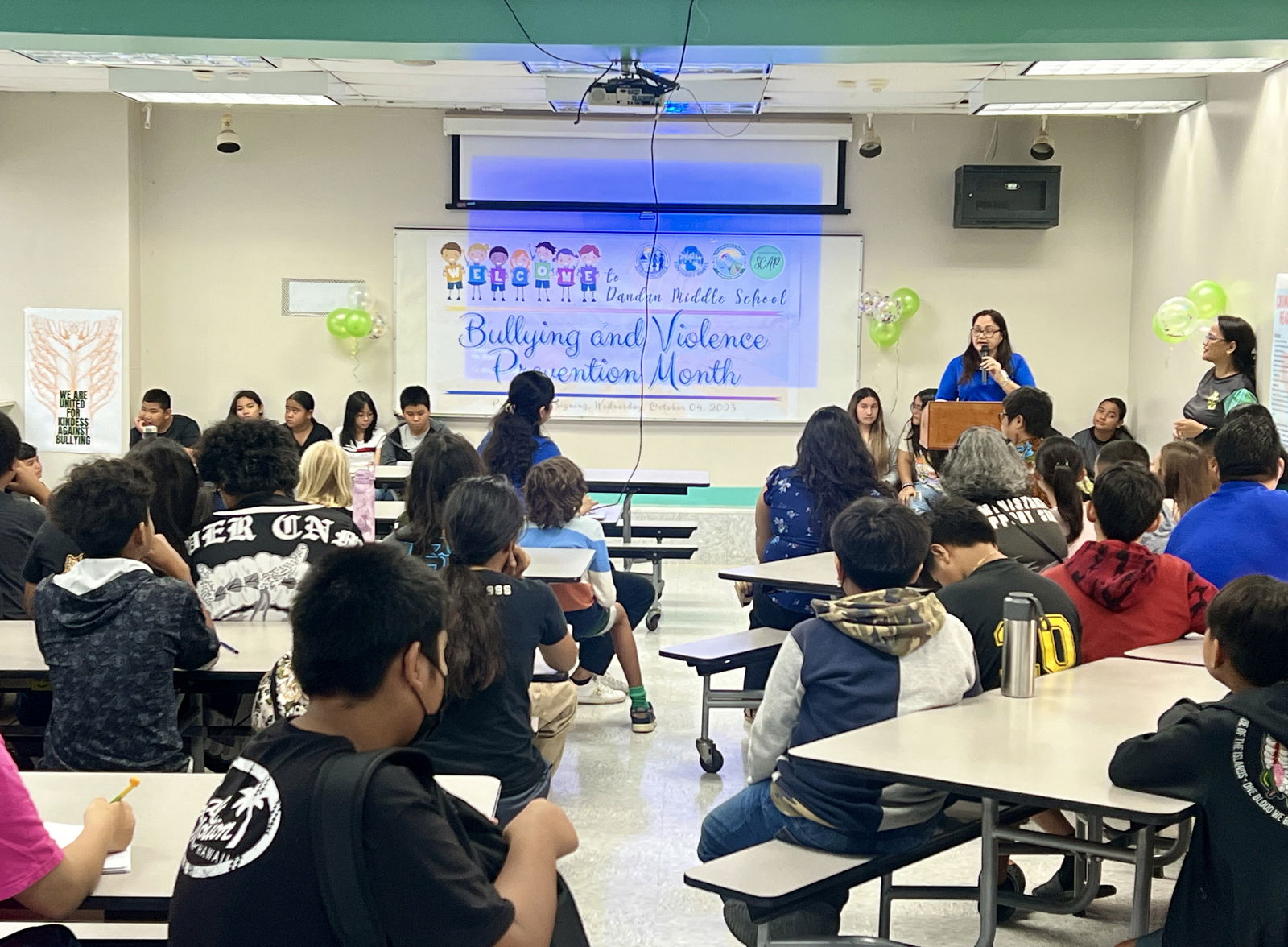 In her remarks during a proclamation-signing ceremony for Bullying and Violence Prevention Month on Wednesday at Dandan Middle School, Interim Commissioner of Education Donna M. Flores reminds students about the importance of being kind and respectful to one another.