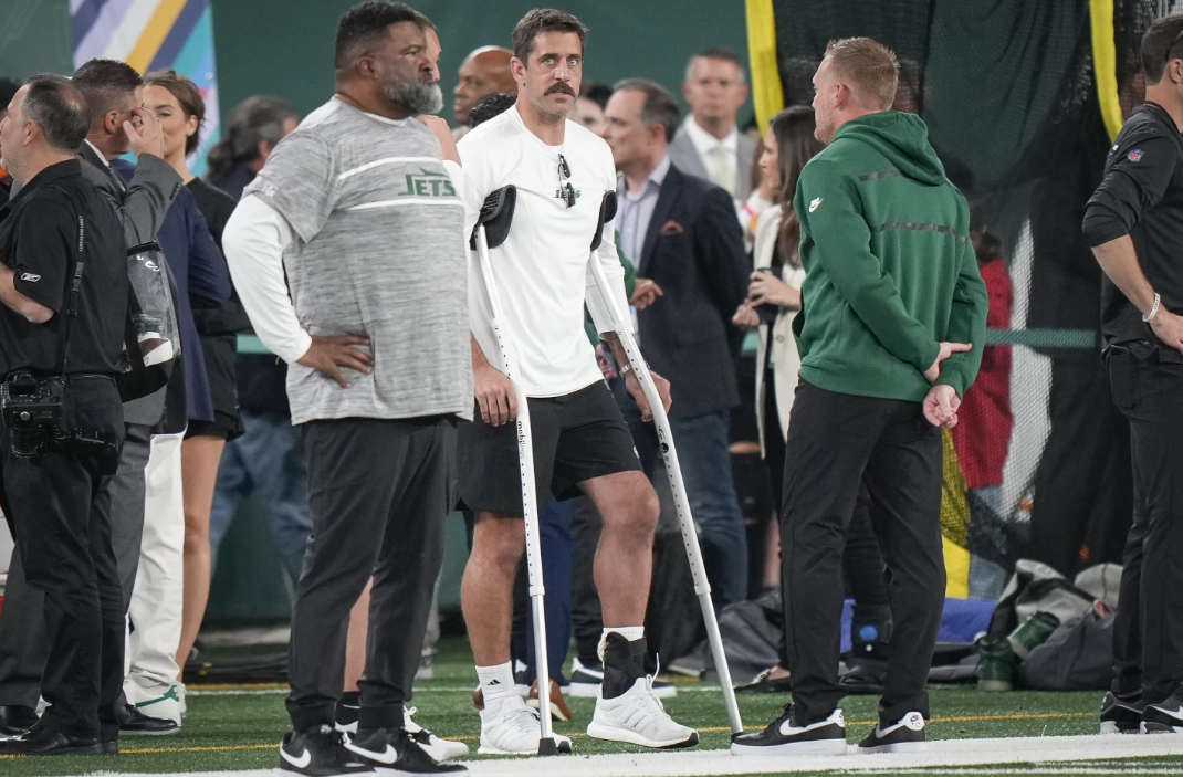 New York Jets quarterback Aaron Rodgers stands on the sidelines before an NFL football game against the Kansas City Chiefs on Sunday, Oct. 1, 2023, in East Rutherford, N.J.