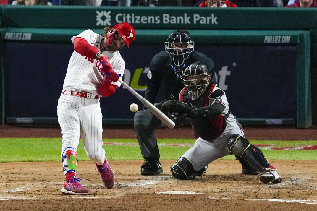 Philadelphia Phillies Bryce Harper hits an RBI-single against the Arizona Diamondbacks during the third inning in Game 1 of the NL Championship Series in Philadelphia, Monday, Oct. 16, 2023.