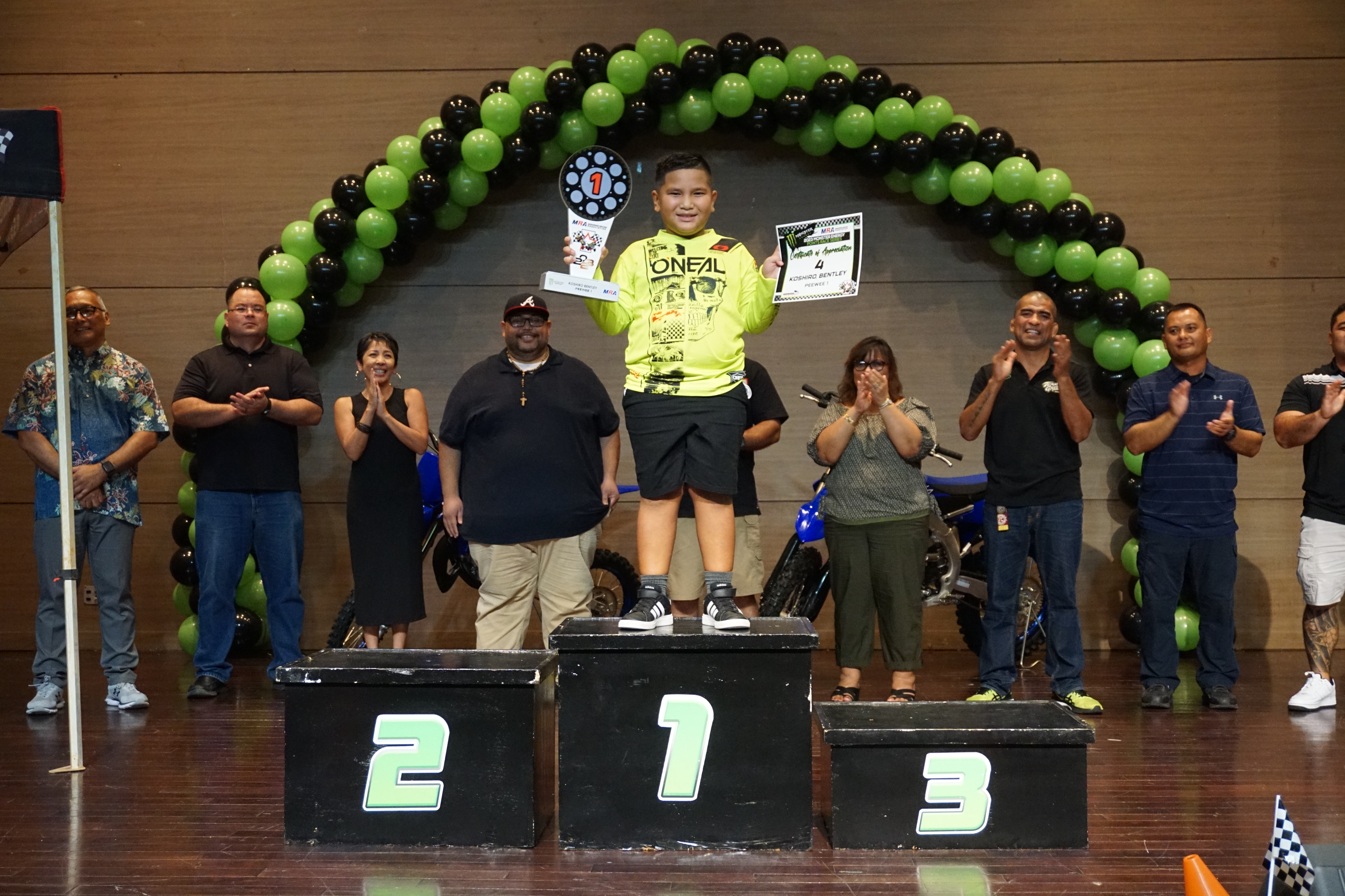 Bentley Koshiro smiles as he poses for the camera with his first-place trophy in the Peewee 1 class of the 2023 MRA Monster Energy Points Race Series during the awards ceremony on Sept. 30 at the Saipan World Resort Taga Hall 