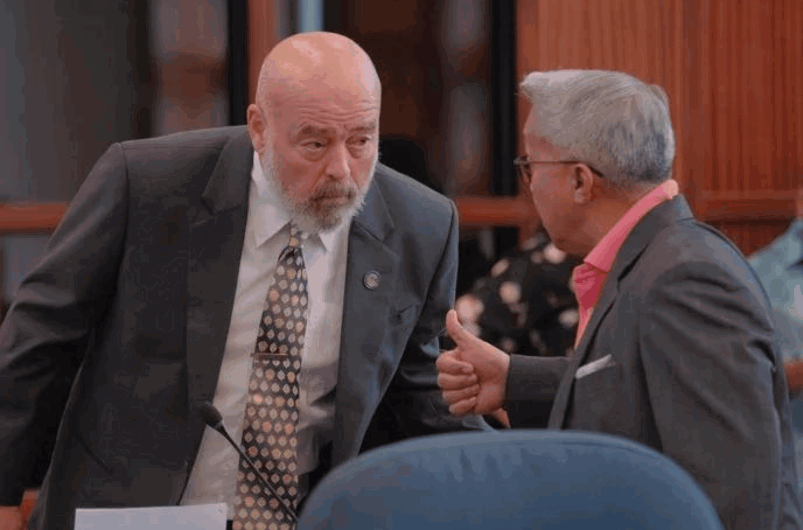 Sens. Tom Fisher, left, and Jesse A. Lujan converse during a regular session at the Guam Congress Building in Hagåtña on Friday, Oct. 27, 2023.