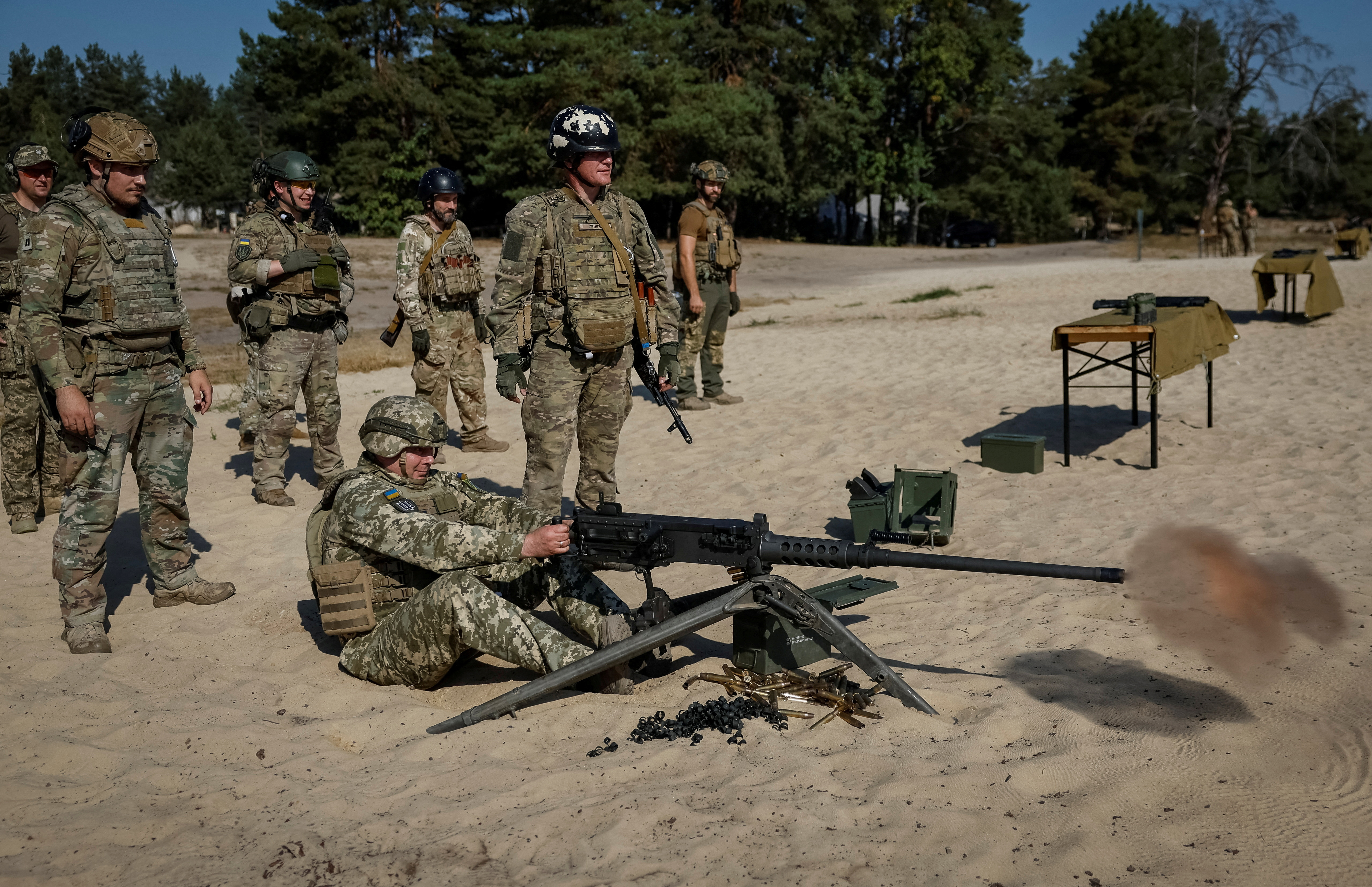 Commander of the Joint Forces of the Armed Forces of Ukraine Serhiy Nayev fires an American Browning M2 machine gun during a military exercise, amid Russia's attack on Ukraine, in Kyiv region, Ukraine September 27, 2023. 