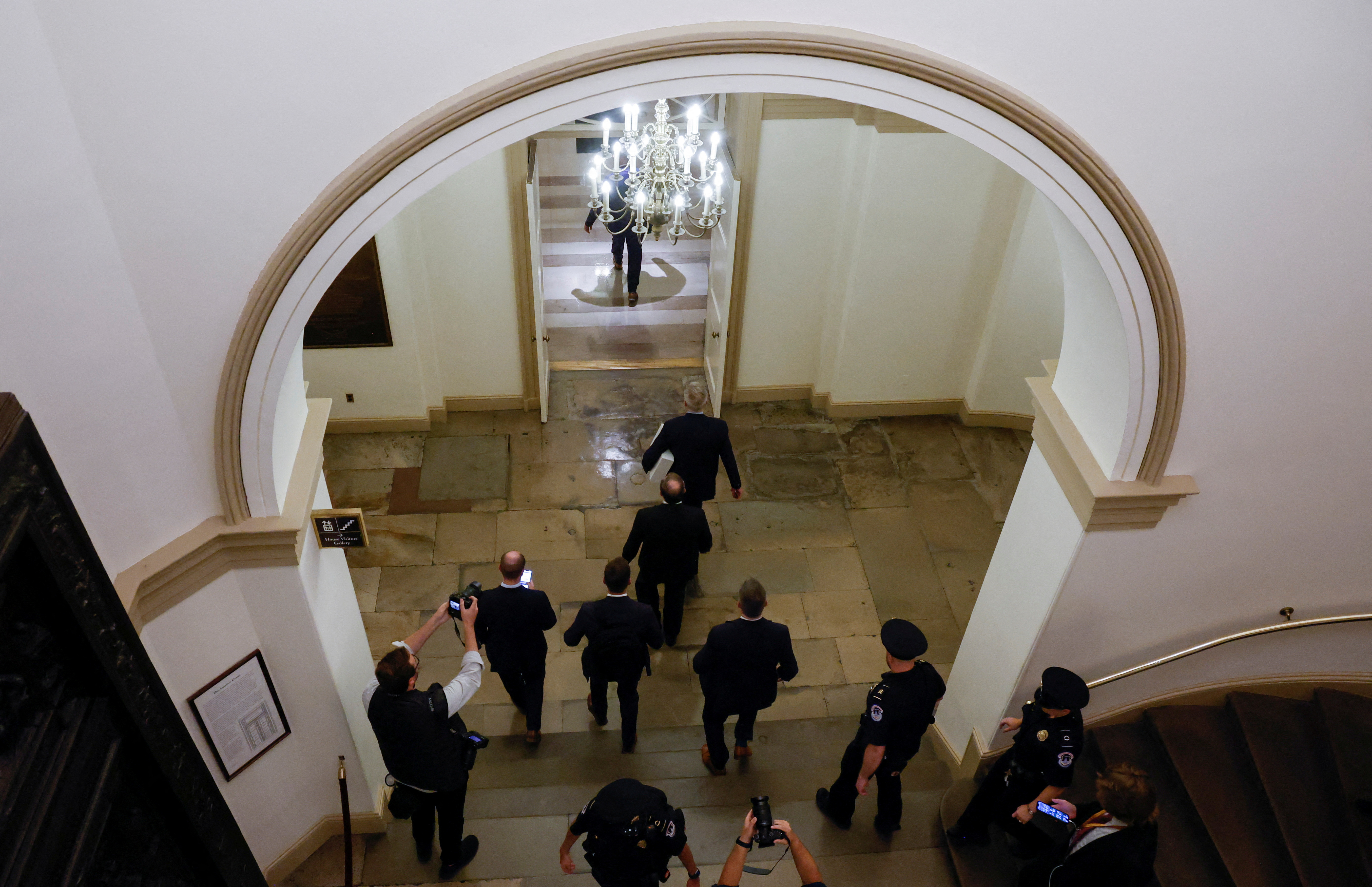 Former Speaker of the House Kevin McCarthy (R-CA) leads the way with his staff and security team carrying a box as he leaves the office of the Speaker of the House and heads out of the U.S. Capitol several hours after being ousted from the position of Speaker by a vote of the House of Representatives on Capitol Hill in Washington, U.S. October 3, 2023. 