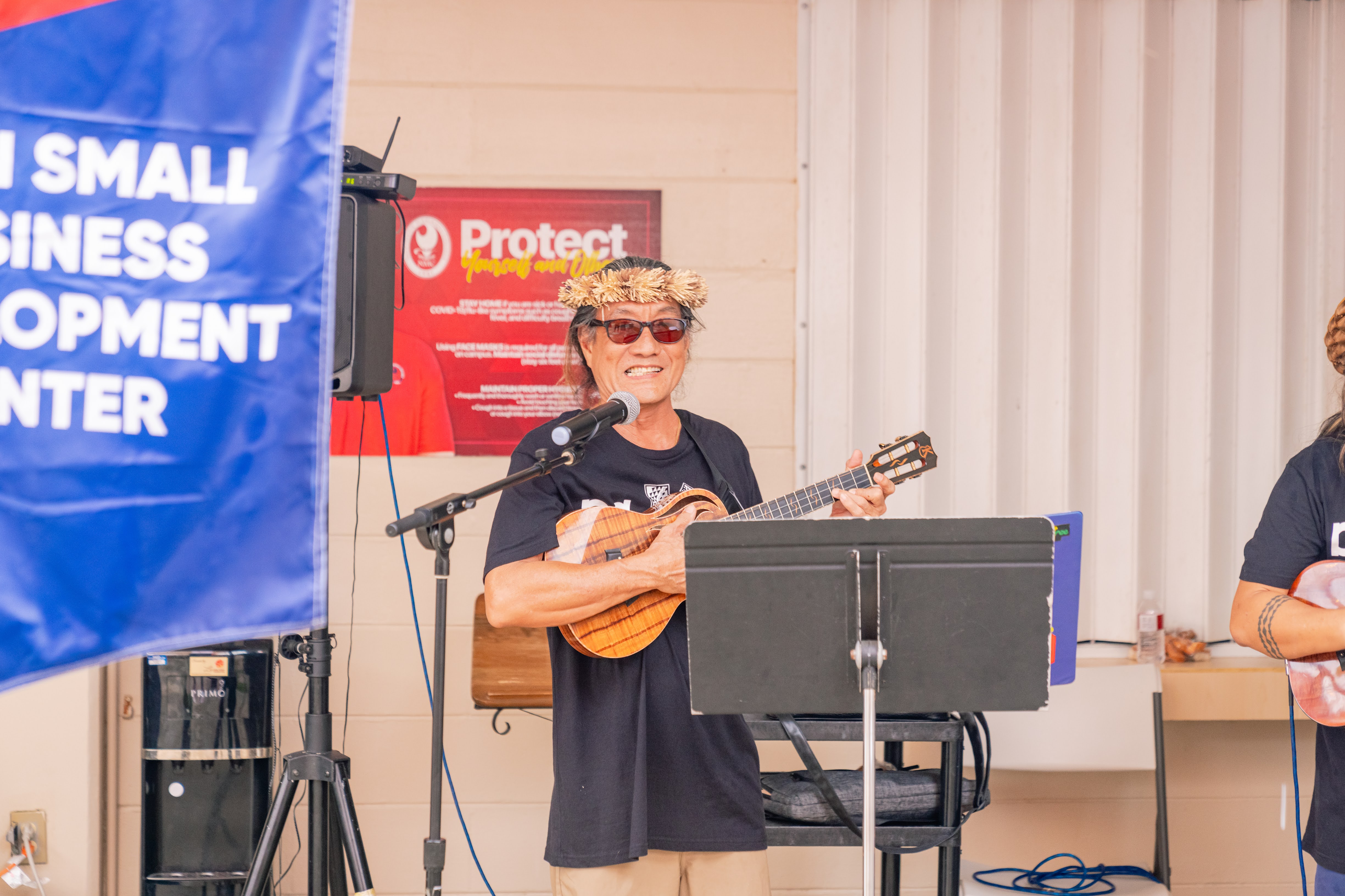 NMC Adjunct Instructor Larry Lee and NMC alumnus Kui Lee of Da Kine perform island music.