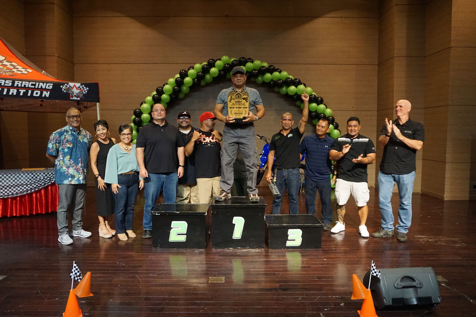 Melvin "The Whip" Cepeda holds the 2023 Rider of the Year trophy as he poses for a photo with Marianas Racing Association officers, Speaker Edmund Villagomez and Rep. Marissa Flores during the awards ceremony of the 2023 MRA Monster Energy Points Race Series  on Saturday at the Saipan World Resort Taga Hall.