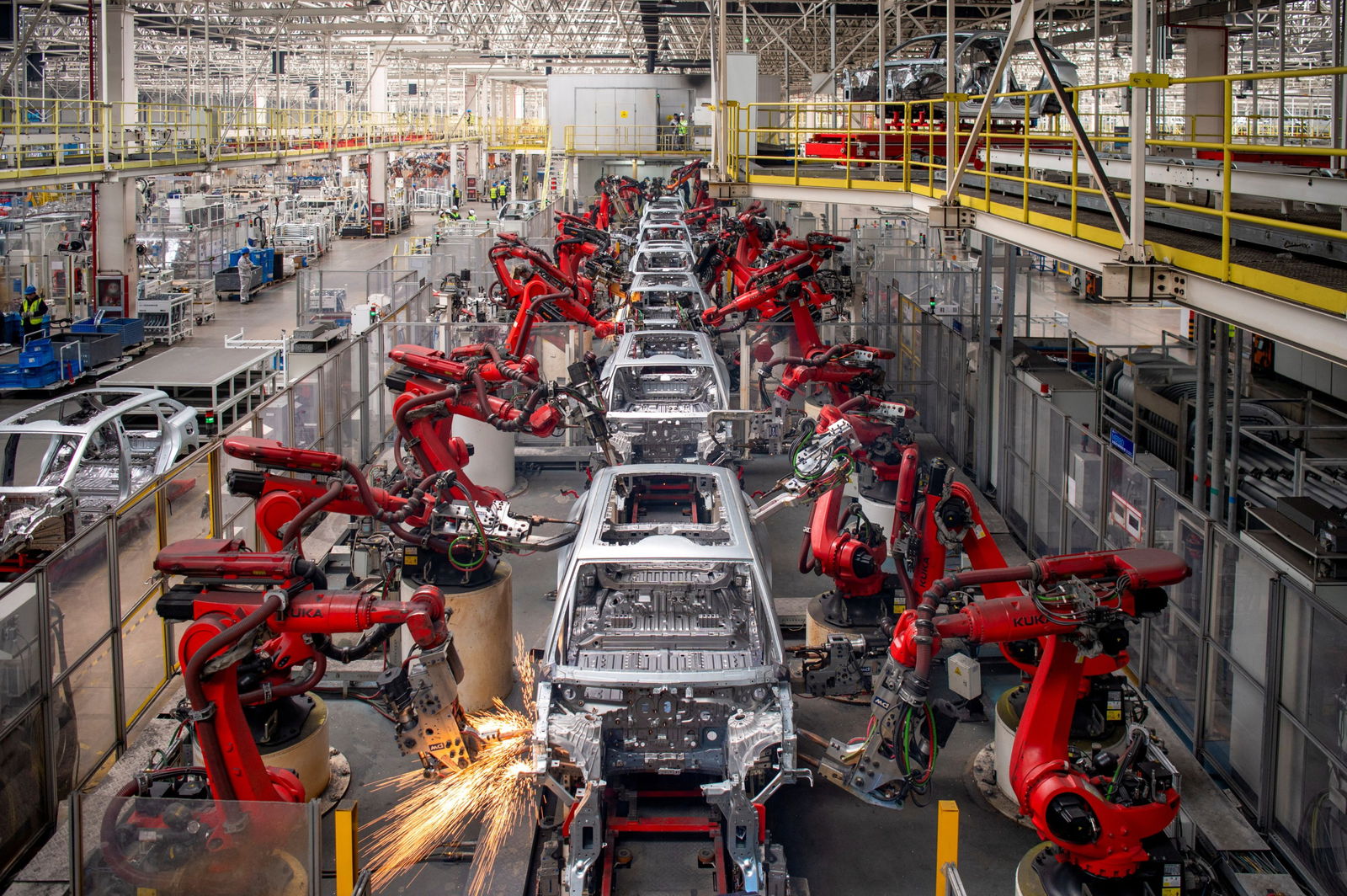 Robotic arms assemble cars in the production line for Leapmotor's electric vehicles at a factory in Jinhua, Zhejiang province, China, April 26, 2023.