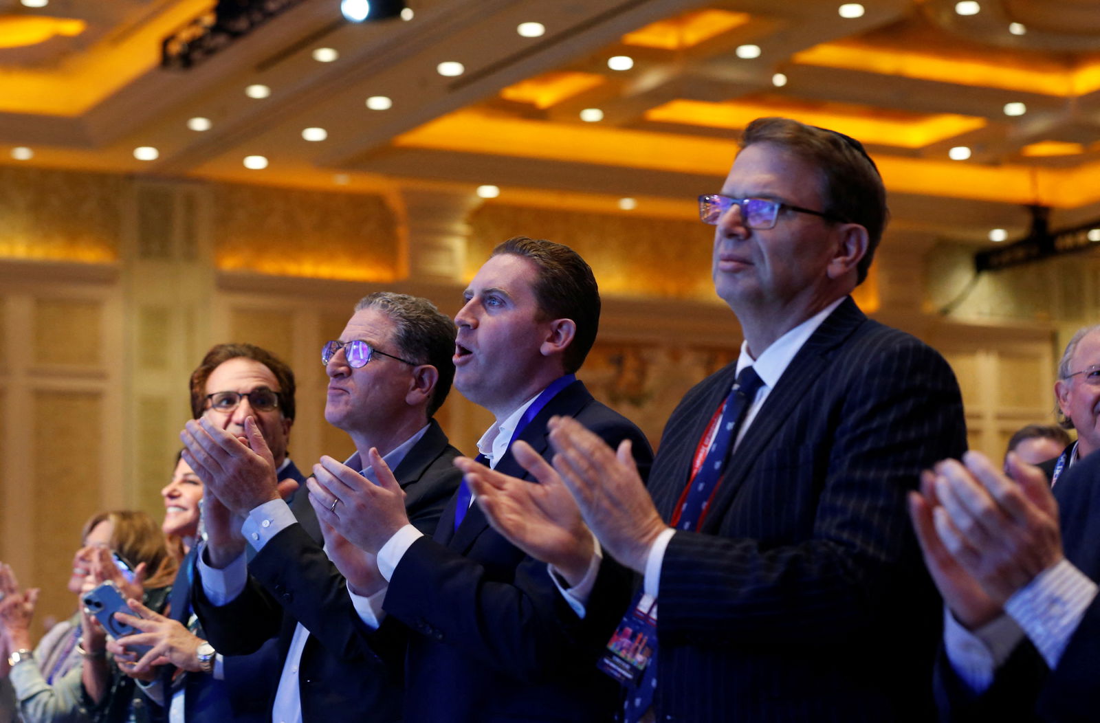 People applaud as Republican U.S. presidential candidate and former U.S. President Donald Trump arrives to speak during the Republican Jewish Coalition Annual Leadership Summit in Las Vegas, Nevada, U.S. October 28, 2023. 