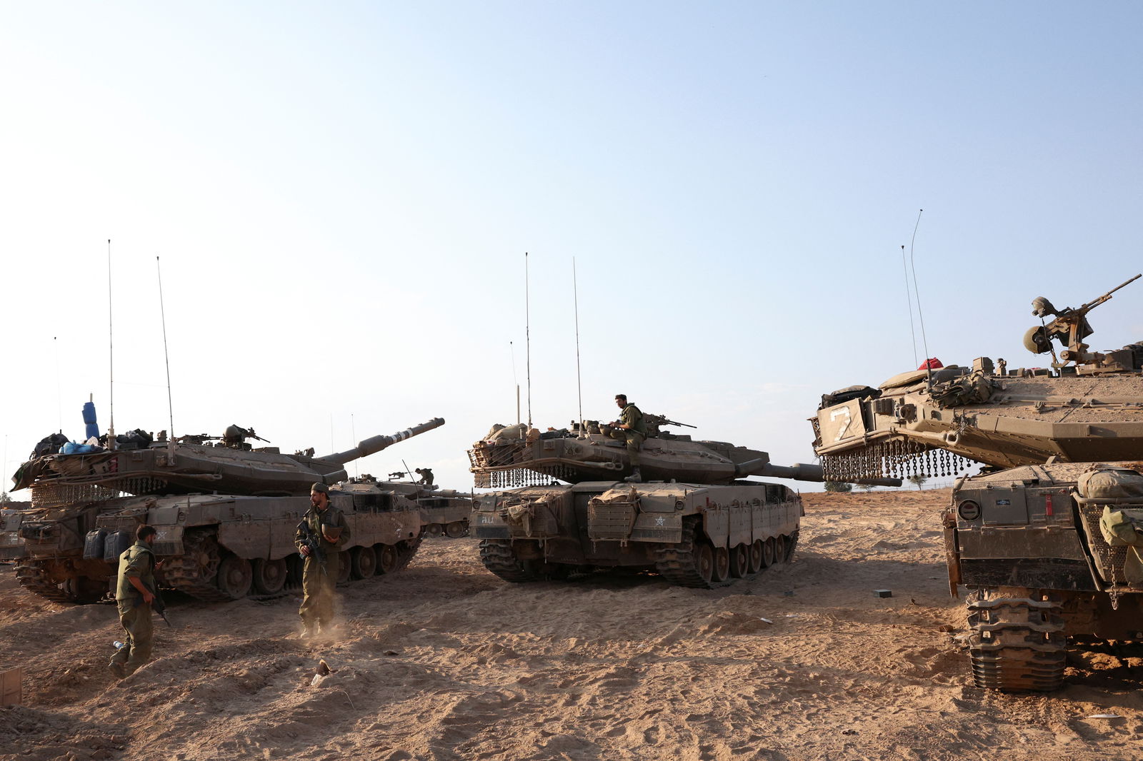 Israeli tanks are seen in the aftermath of a mass infiltration by Hamas gunmen from the Gaza Strip, in Kibbutz Beeri in southern Israel, Oct. 14, 2023.