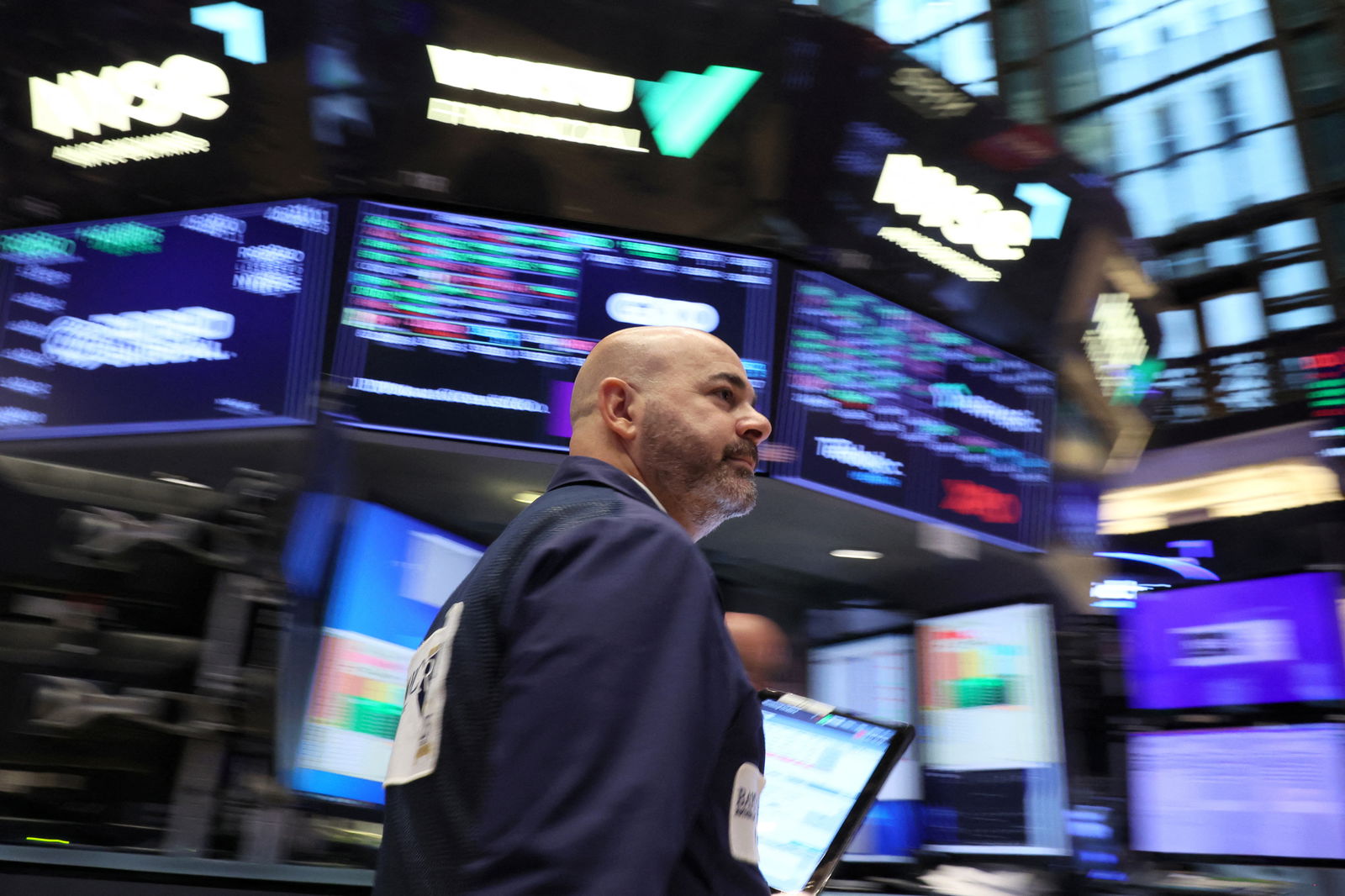 A trader works on the floor at the New York Stock Exchange (NYSE) in New York City, U.S., October 27, 2023. 