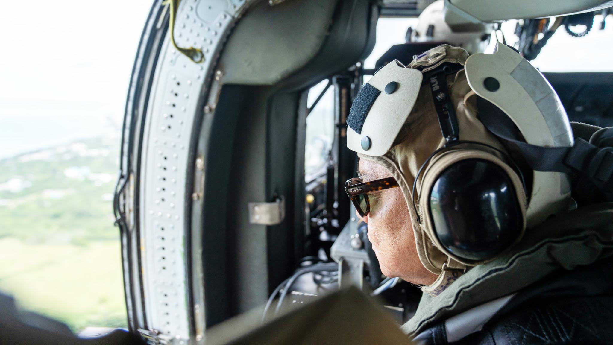 Gov. Arnold I. Palacios conducts an aerial assessment of  Rota onWednesday afternoon on a U.S. Navy helicopter. With the governor are officials of the Federal Emergency Management Agency and Rota Mayor Aubry Hocog.  Typhoon Bolaven made its closest point of approach to Rota on Tuesday night.