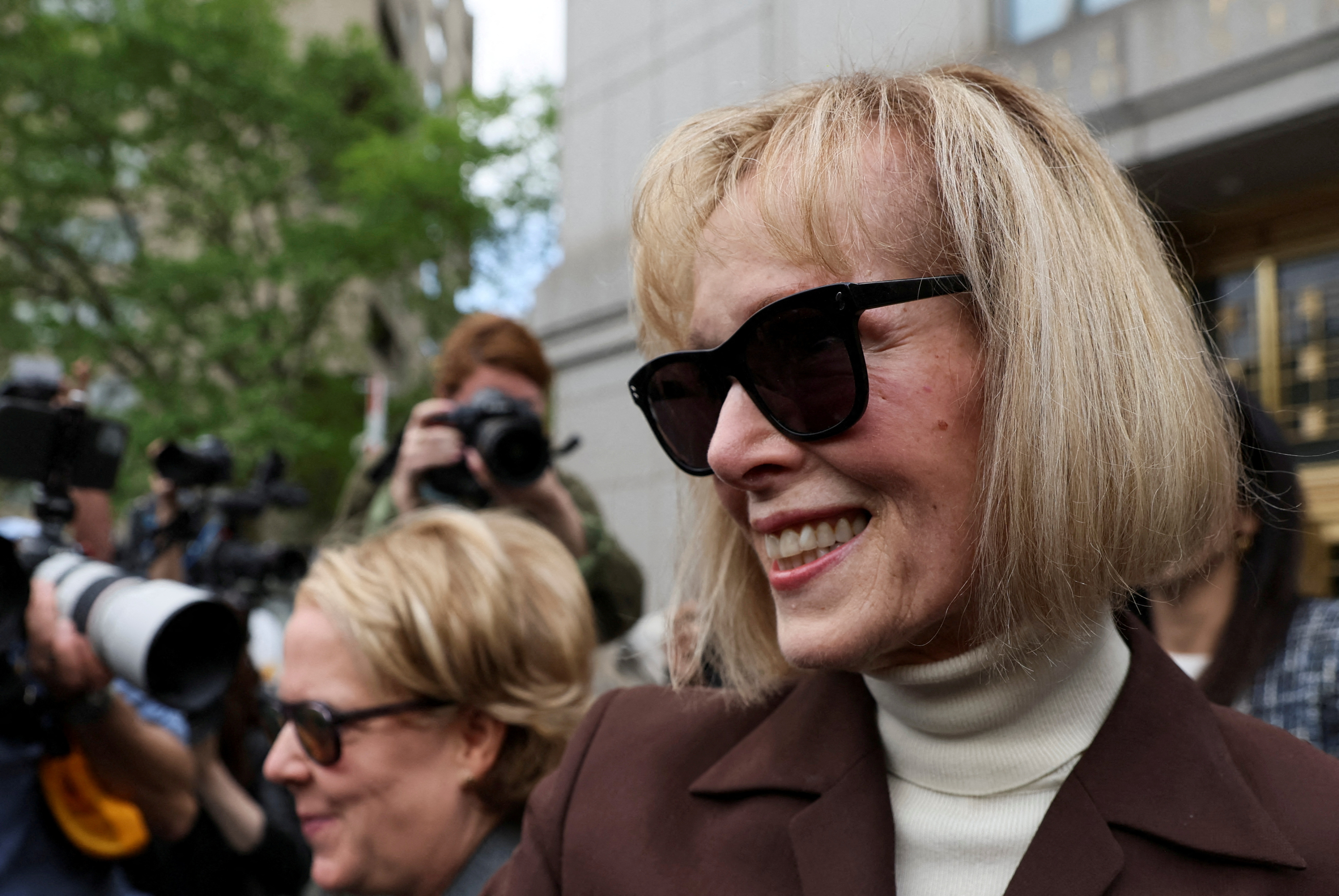 E. Jean Carroll reacts as she exits the Manhattan Federal Court following the verdict in the civil rape accusation case against former U.S. President Donald Trump, in New York City, U.S., May 9, 2023. 