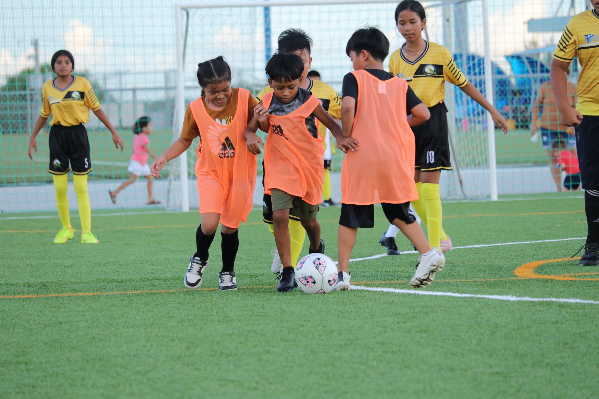Three Sinapalo Elementary School players rush after the possession during an exhibition match in the elementary school division of the NMIFA-PSS Interscholastic Soccer League SY23-24 on Friday at the NMI Soccer Training Center in Koblerville.