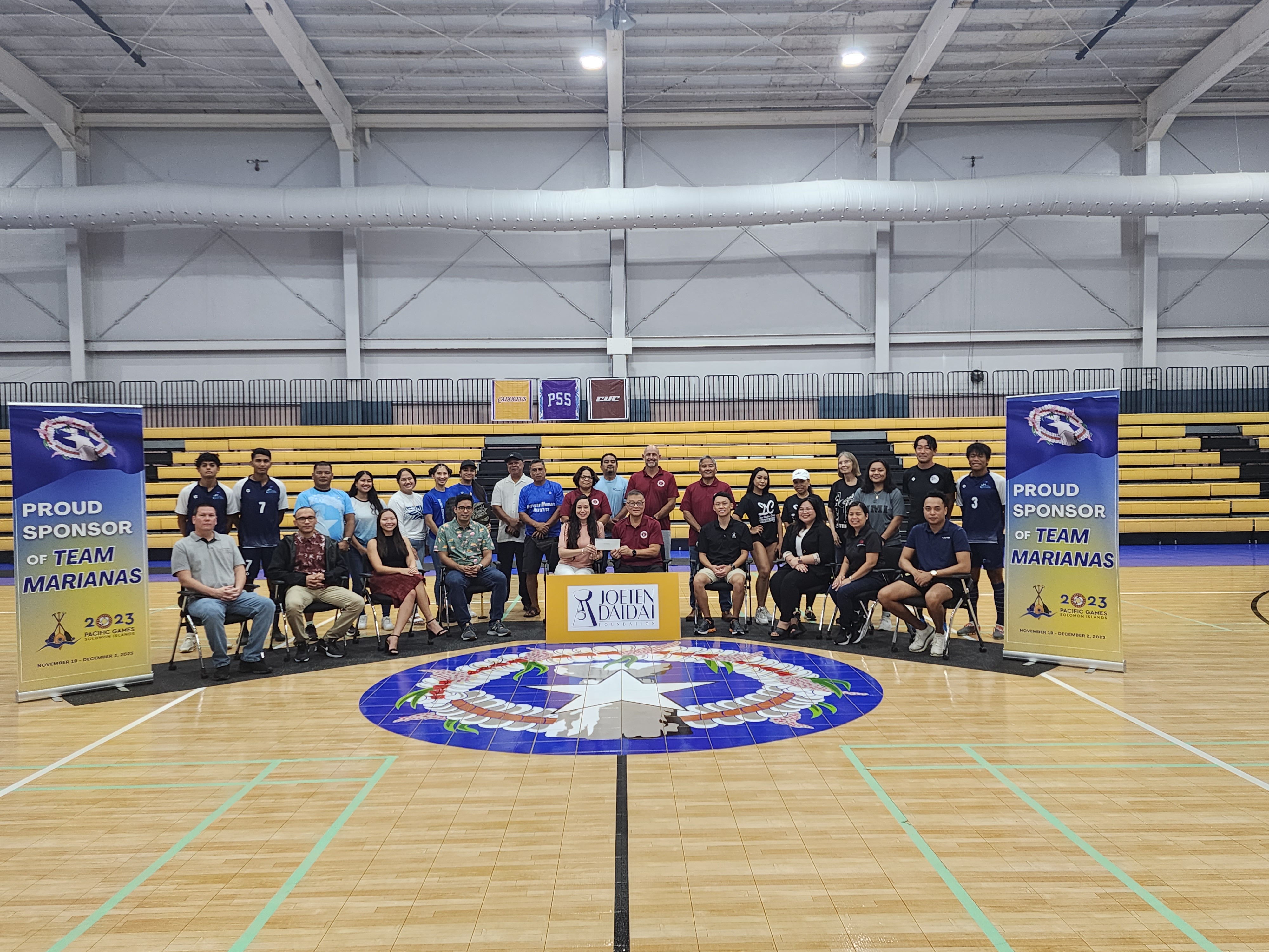 Joeten Daidai Foundation officials and Northern Marianas Sports Association President Jerry Tan pose for a photo with the NMI athletes that will be compete in the 2023 Pacific Games from Nov. 19 to Dec. 2 in Honiara, the Solomon Islands.