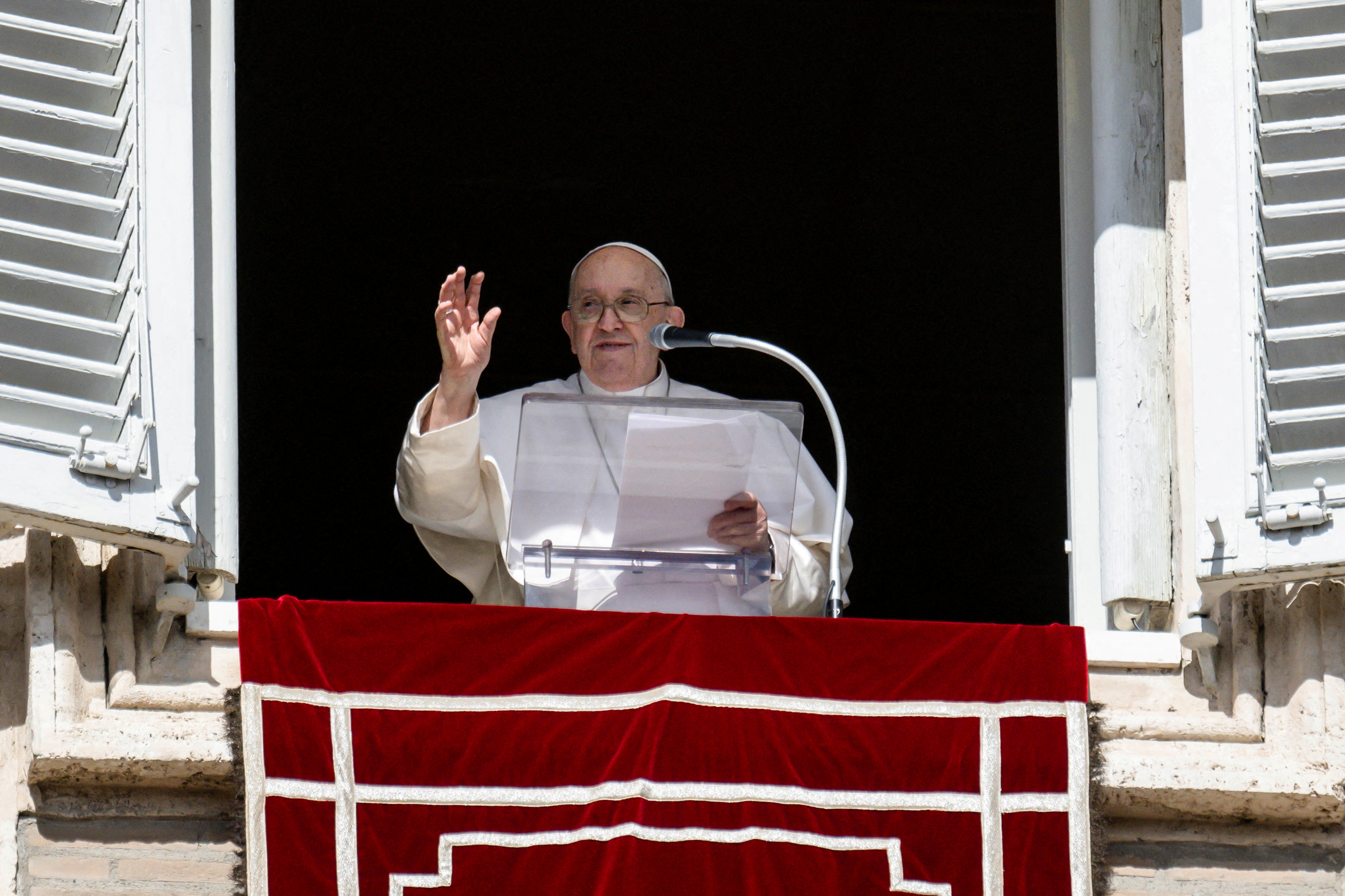 Pope Francis leads the Angelus prayer from his window at the Vatican, October 22, 2023. 