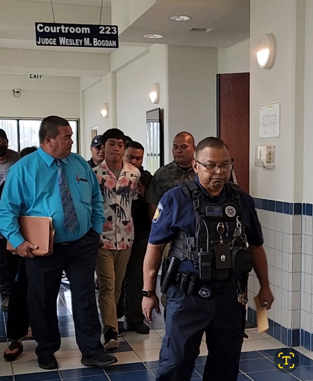 With his family members and lawyer, Kenneth Thomas Blas Kaipat leaves the courtroom in the custody of CNMI Marshals after he was sentenced on Friday.           