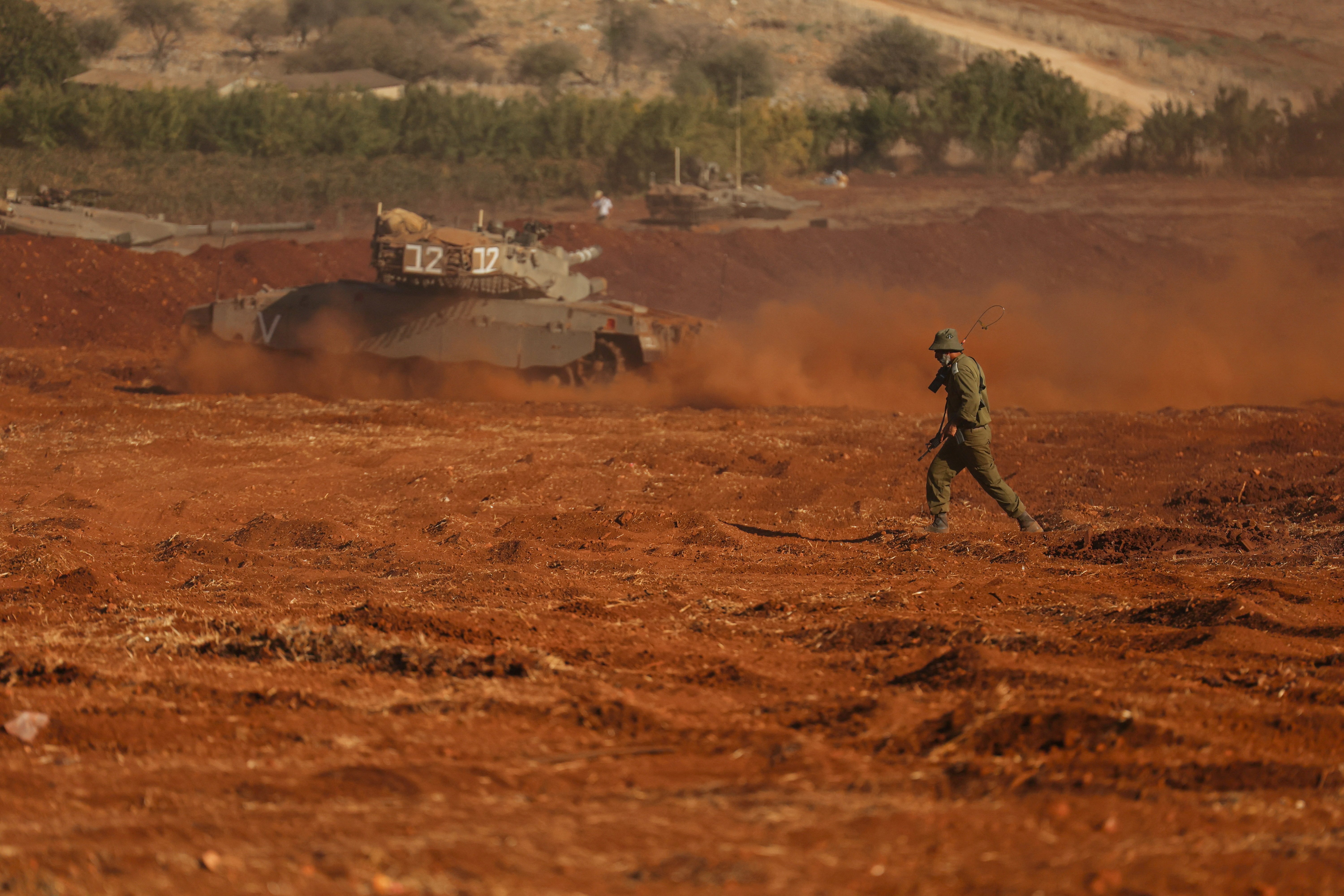 Israeli tanks are seen during a military drill near Israel's border with Lebanon in northern Israel, October 26, 2023. 