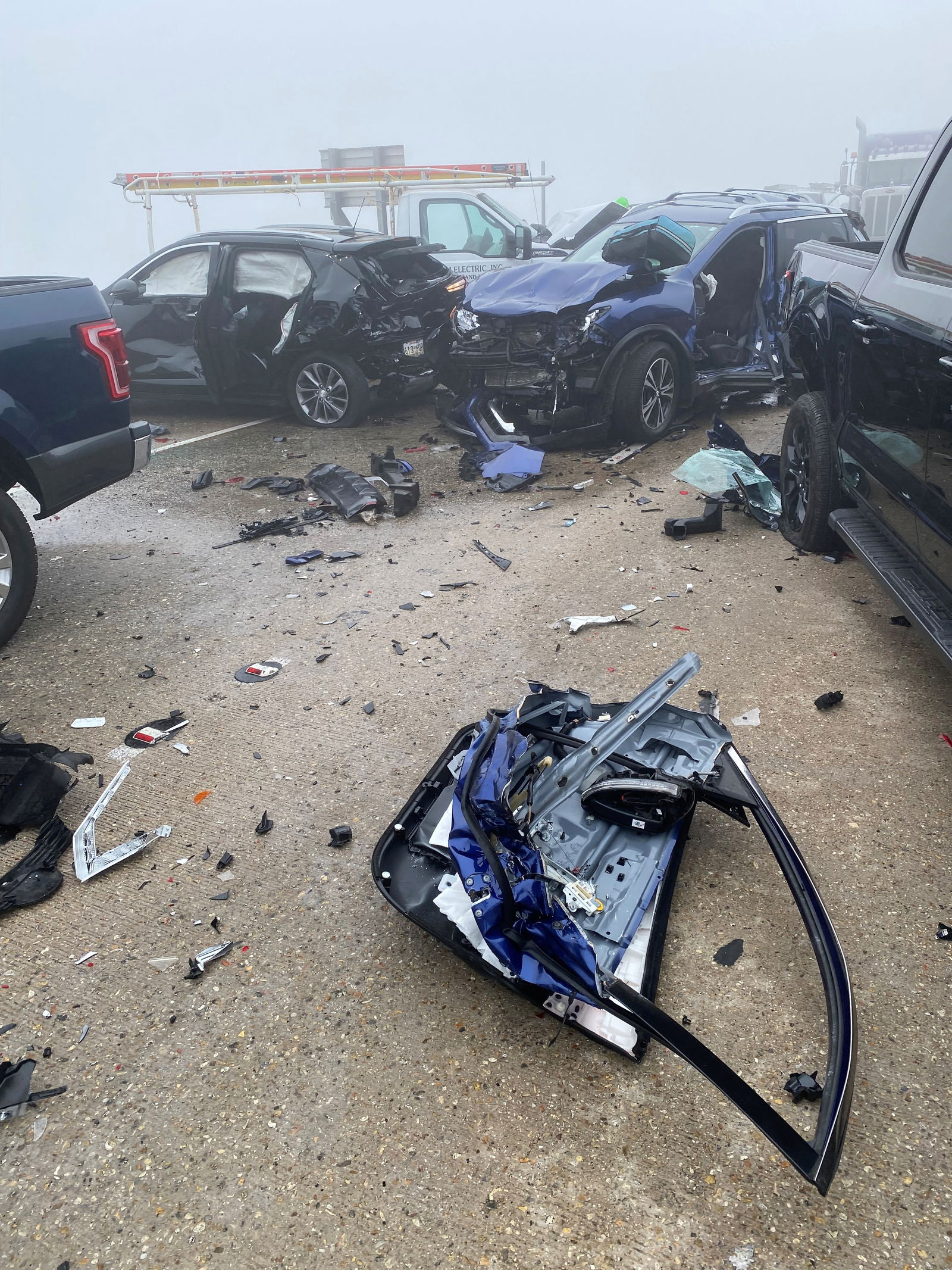 Crashed cars and debris are seen along a street, following a vehicle pile-up due to a "super fog" aggravated by marsh fires, in Louisiana, U.S., October 23, 2023 in this picture obtained from social media. 