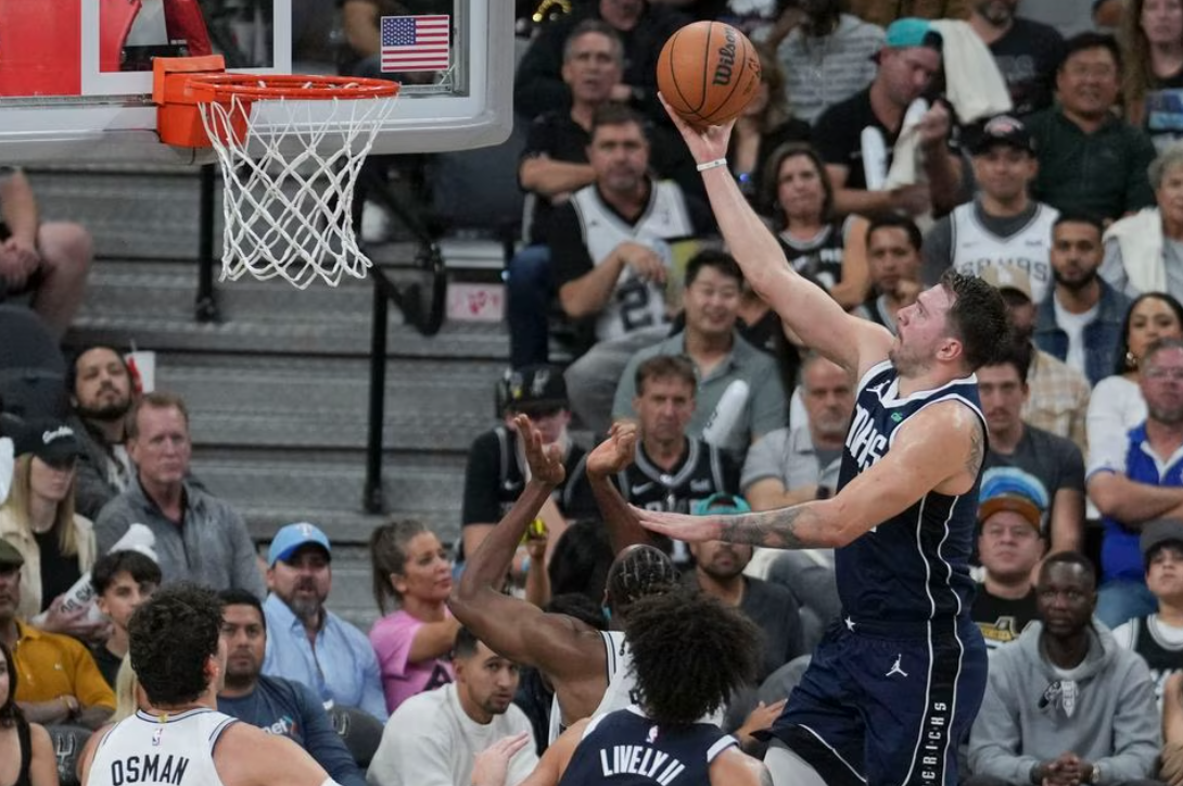 Dallas Mavericks guard Luka Doncic (77) shoots in the second half against the San Antonio Spurs at the Frost Bank Center in San Antonio, Texas, Oct. 25, 2023.