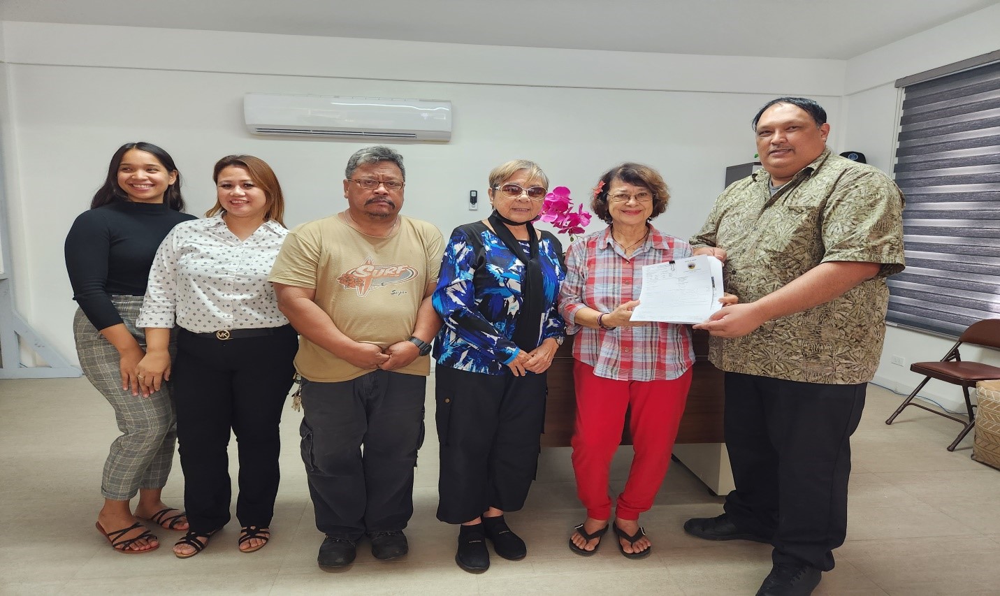 From left, Darsha Camacho, Office of Grants Management fiscal analyst; Maria Deleon Guerrero, OGM, grants specialist; Donald Crisostimo, municipal council staff member; Council Vice Chairwoman Tonie M. Tudela; Council Chairwoman Marian DLG Tudela; and OGM Director Epi Cabrera.