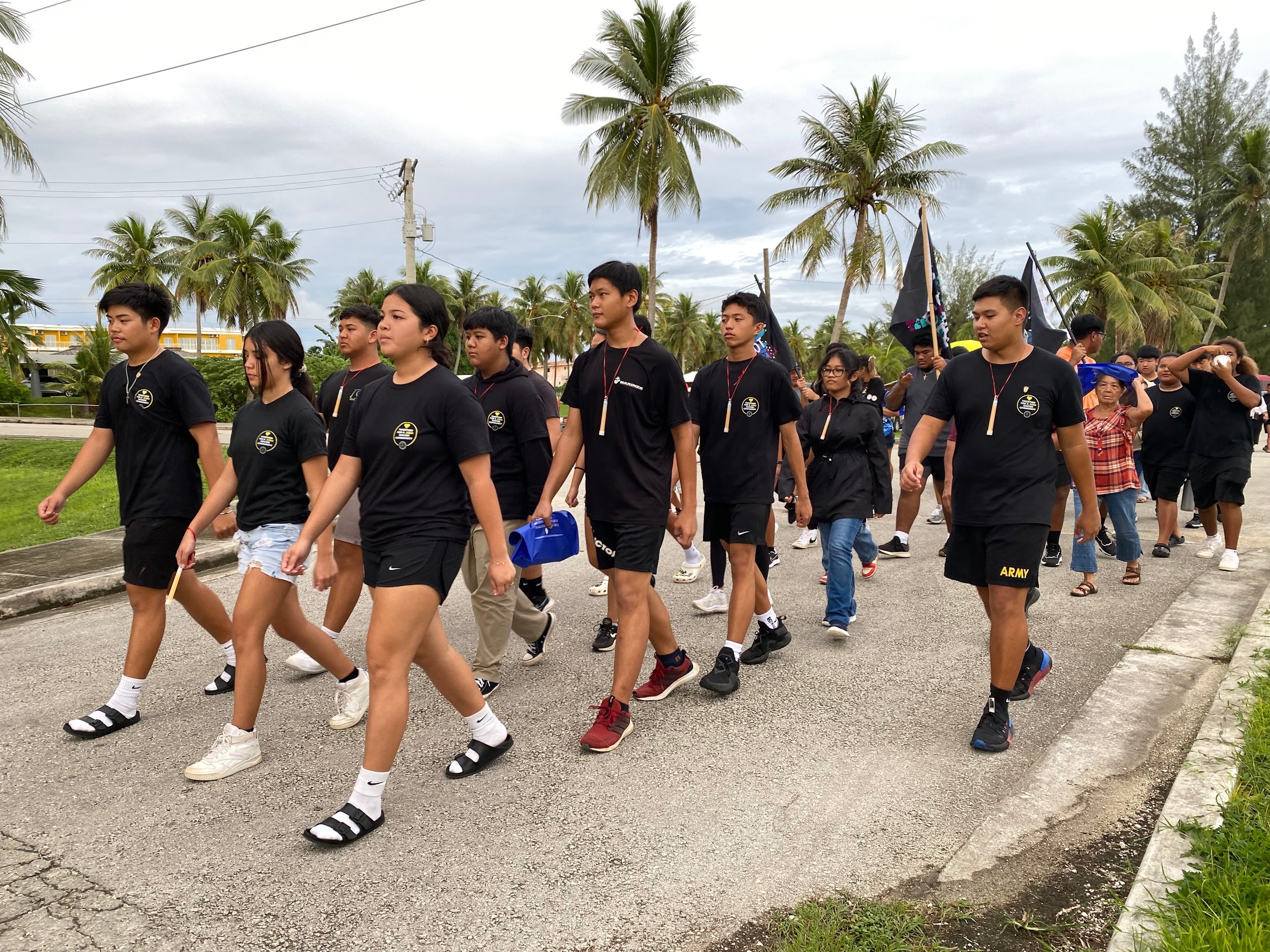 Stallion Battalion marches as they lead Tinian’s 2023 Light Up the Night on Sept. 29, 2023.