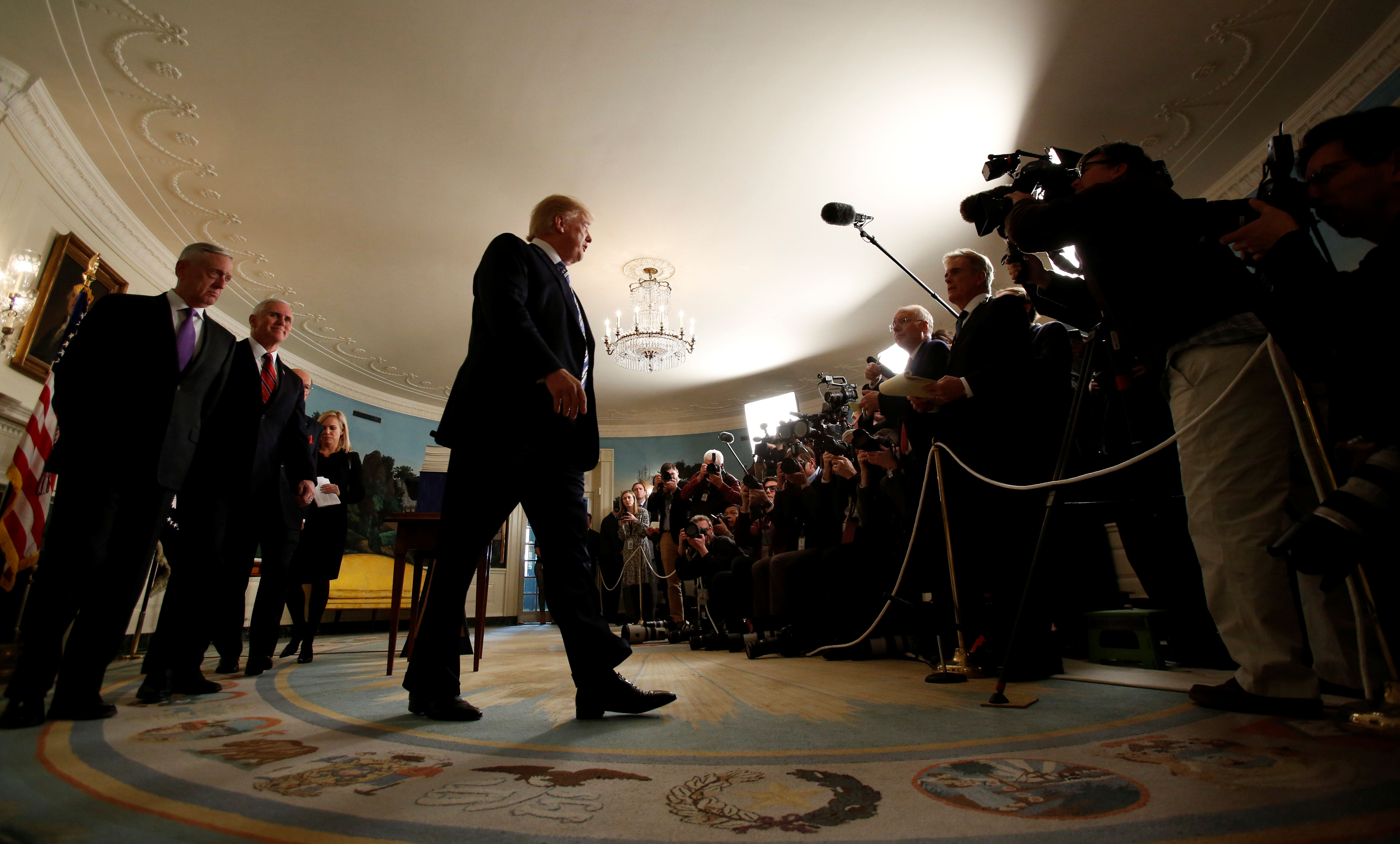 U.S. President Donald Trump departs, after speaking about Congress' $1.3 trillion spending bill, during a signing ceremony for the bill, in the Diplomatic Room of the White House in Washington, D.C., U.S., March 23, 2018. 