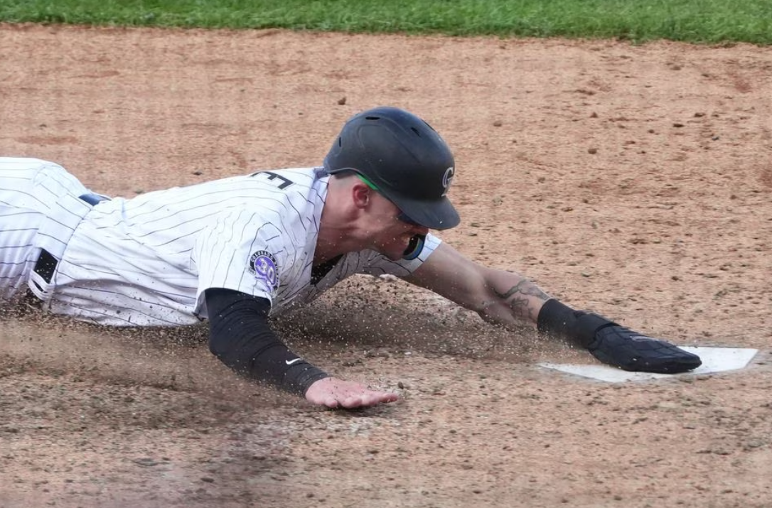 Colorado Rockies center fielder Brenton Doyle (9) scores on a wild pitch in the eleventh inning to defeat the Minnesota Twins at Coors Field in Denver, Colorado, Oct. 1, 2023.