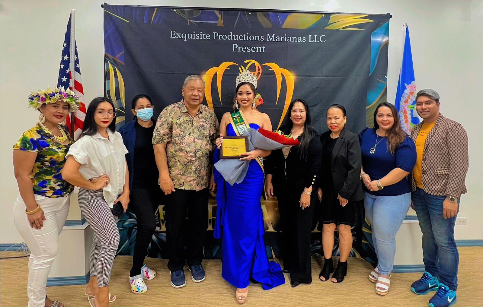 Miss Northern Marianas Earth 2023 Jan Zowie Cruz poses for a photo with Lt. Gov. David M. Apatang, fourth left, Exquisite Production's Dee Clayton, third right, and other Exquisite officers on Sept. 22, 2023.