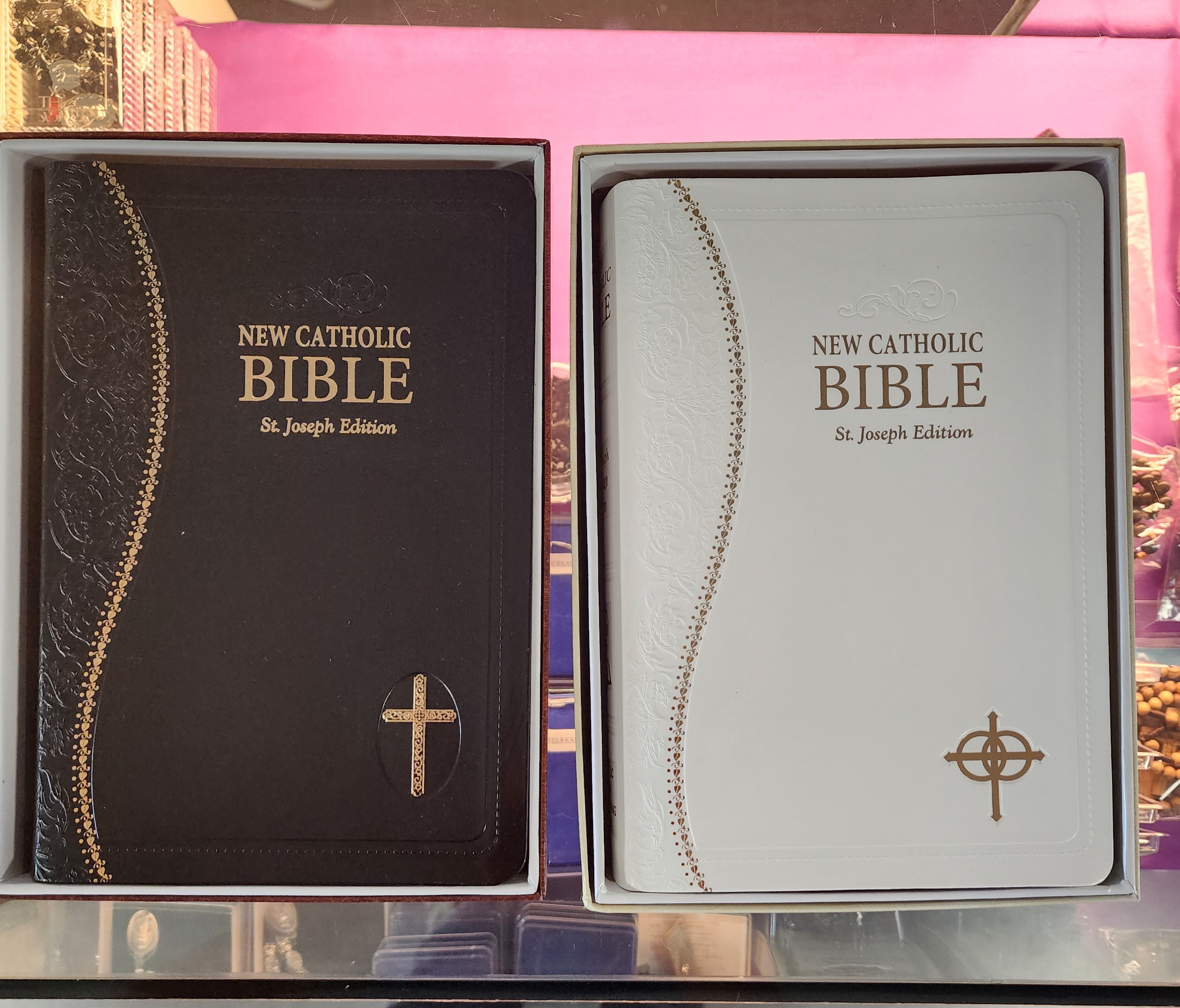 Two Catholic Bibles: the black one is for personal use while the white one is for weddings.
