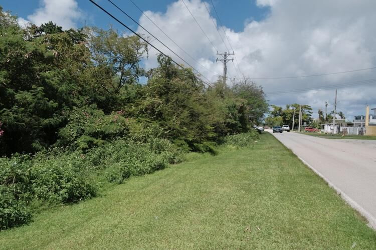 The vacant lot between the Guam Cultural Repository and the F&J Building is pictured Friday, Oct. 20, 2023, along Route 32 in Mangilao. 