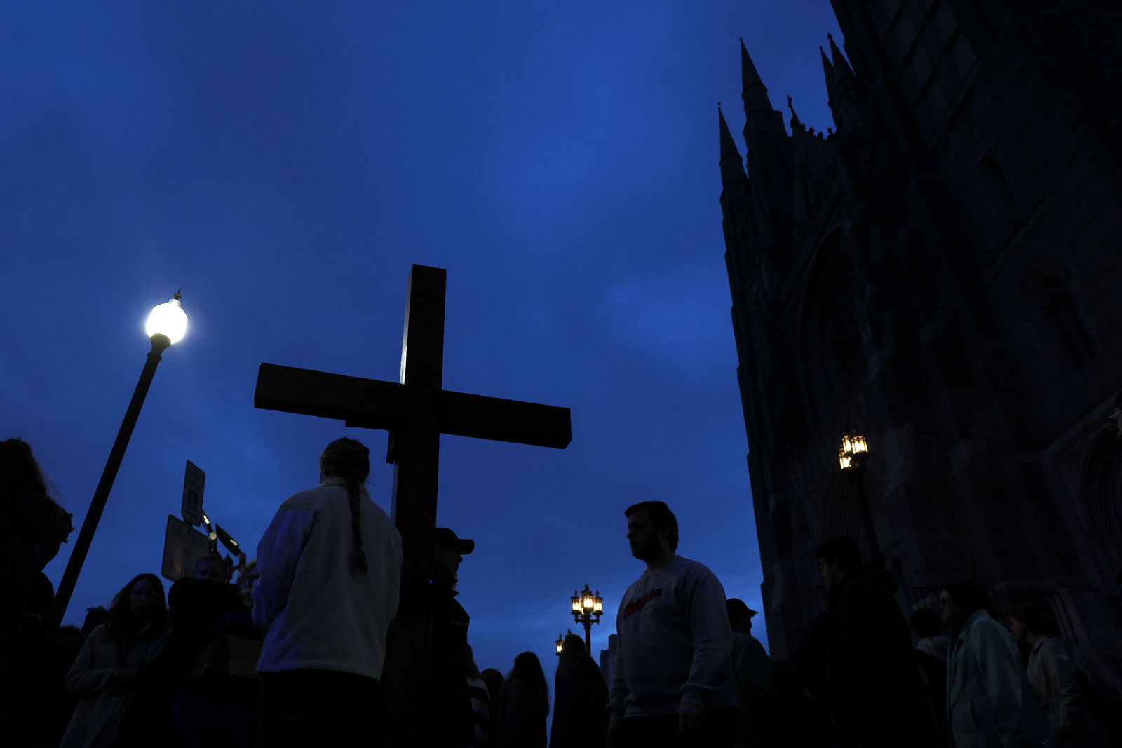 Mourners take part in a vigil for the victims of the deadly mass shooting outside the Basilica of Saints Peter and Paul, in Lewiston, Maine, U.S., October 29, 2023. 