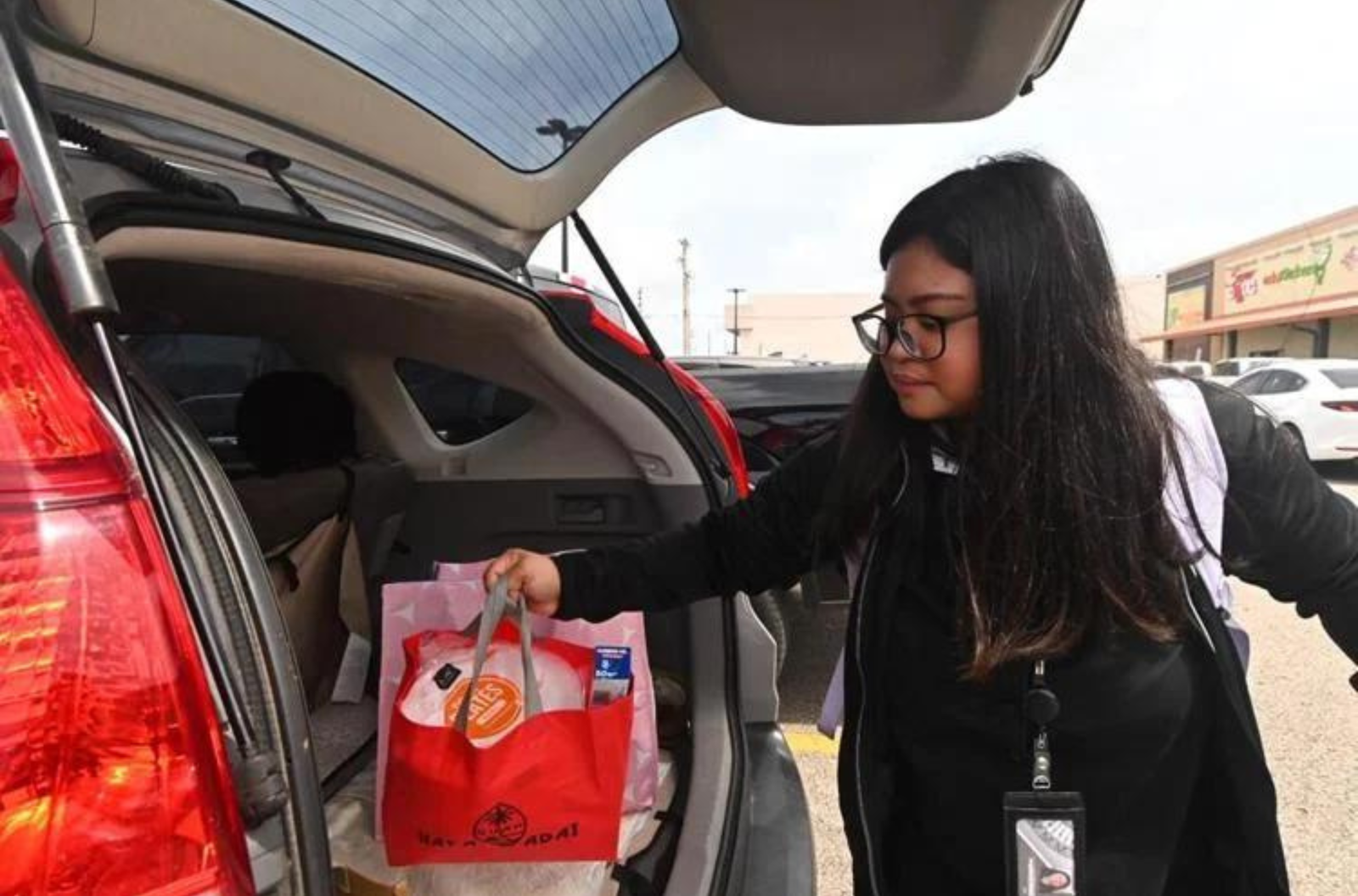 Angelica Roque, from Dededo, purchases last-minute supplies in preparation for Tropical Storm Bolaven Monday, Oct. 9, 2023, at the Pay-Less Market in Maite. 