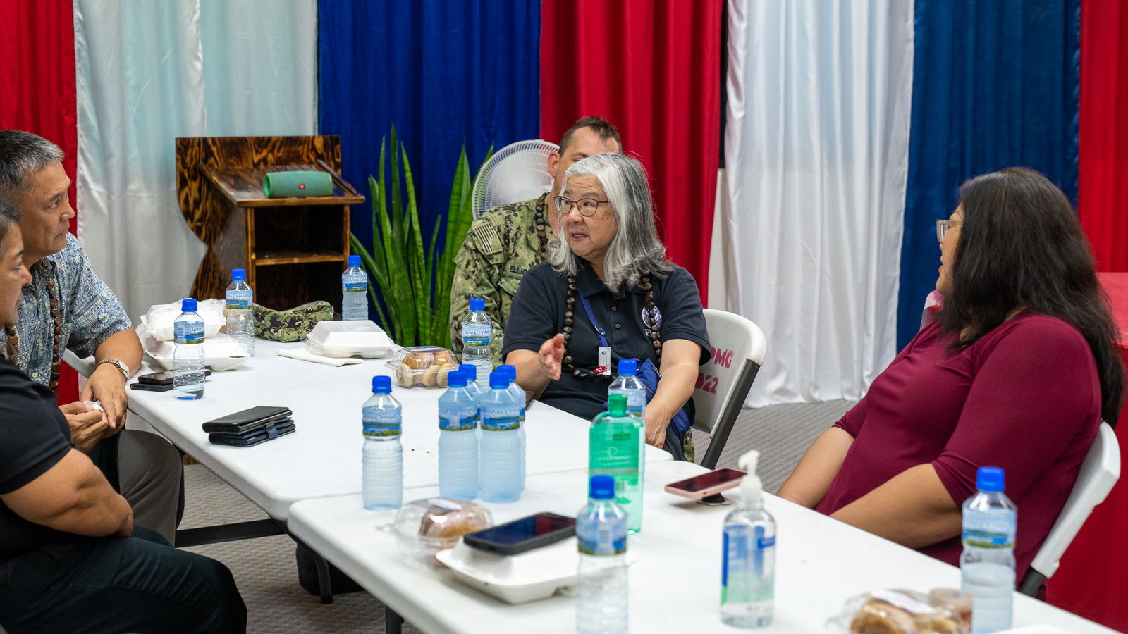 Federal Emergency Management Agency Region 9 team lead Teresa Serata speaks to Rota Mayor Aubry Hocog, Gov. Arnold I. Palacios (not in photo), CNMI Homeland Security and Emergency Management  Special Assistant Franklin Babauta, U.S. Navy Capt. Harry Elliott IV and CNMI HSEM Rota Representative Vivian Hocog during a preliminary meeting on Rota after the storm.