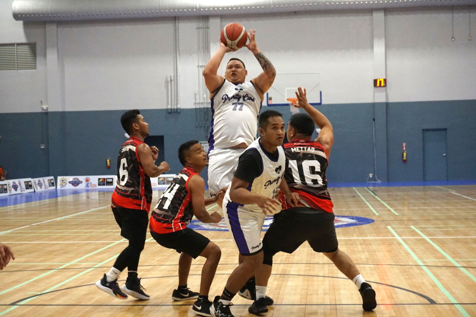 Priority Care's Matt Duenas takes the jump-shot over three defenders during a game against Marpac in the 2023 R&J Wine and Liquor Inter-Government/Business League at the Ada gym.