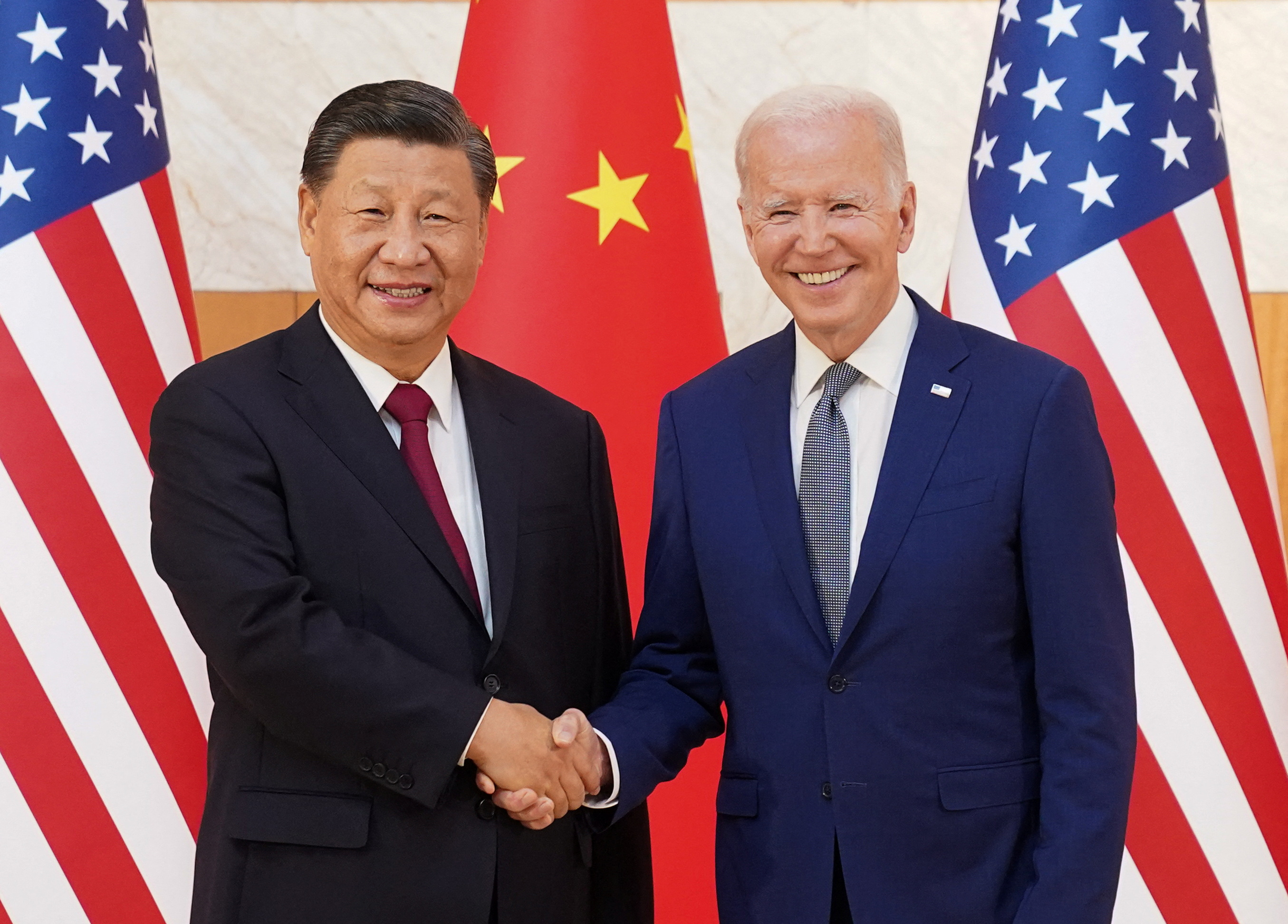 U.S. President Joe Biden shakes hands with Chinese President Xi Jinping as they meet on the sidelines of the G20 leaders' summit in Bali, Indonesia, November 14, 2022.